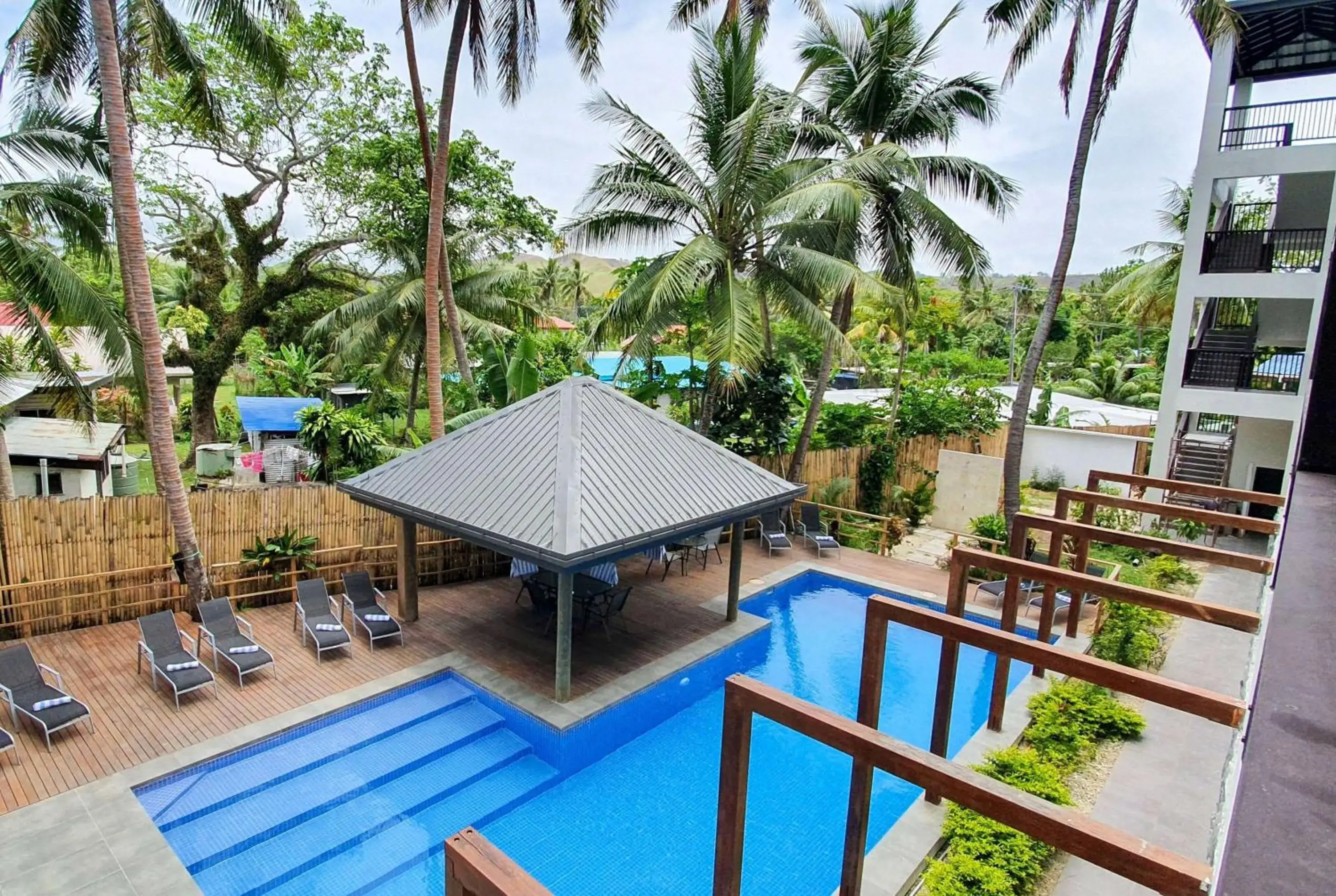 Pool view in Ramada Suites By Wyndham Seafront Coral Coast Pool view in Ramada Suites By Wyndham Seafront Coral Coast