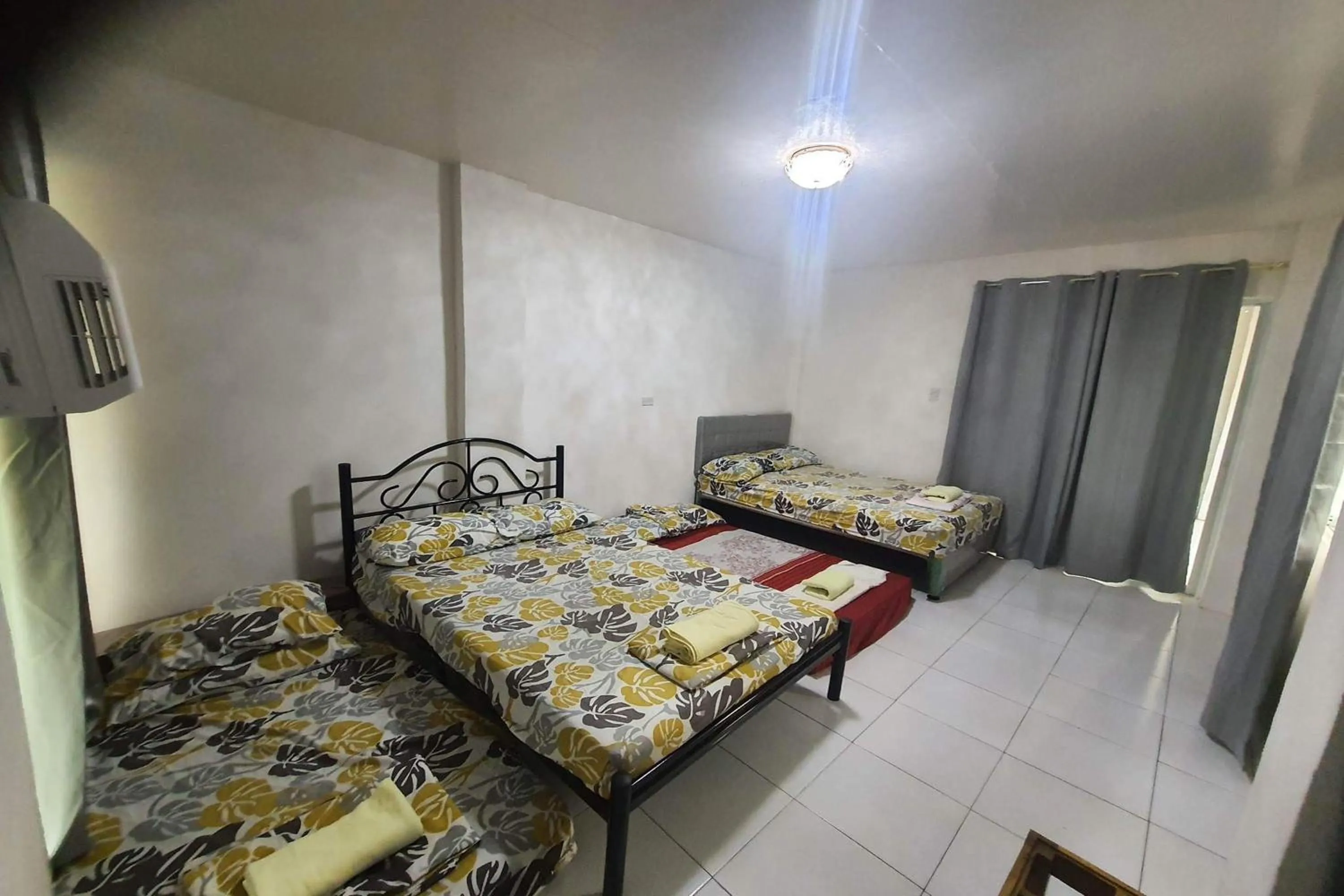 Photo of the whole room, Bed in Bohol Transient Lruy near Panglao Beach