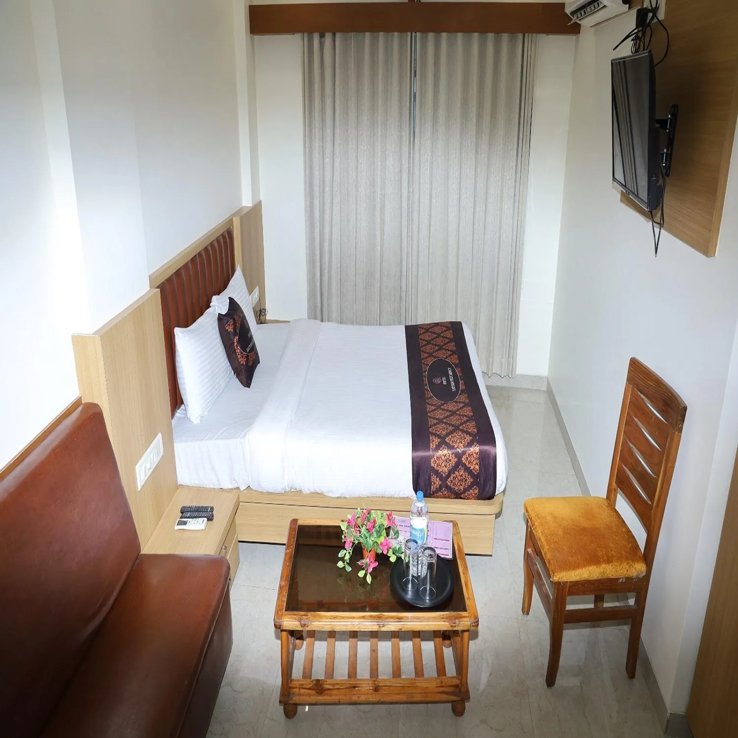 Bed in Hotel Satyam Residency