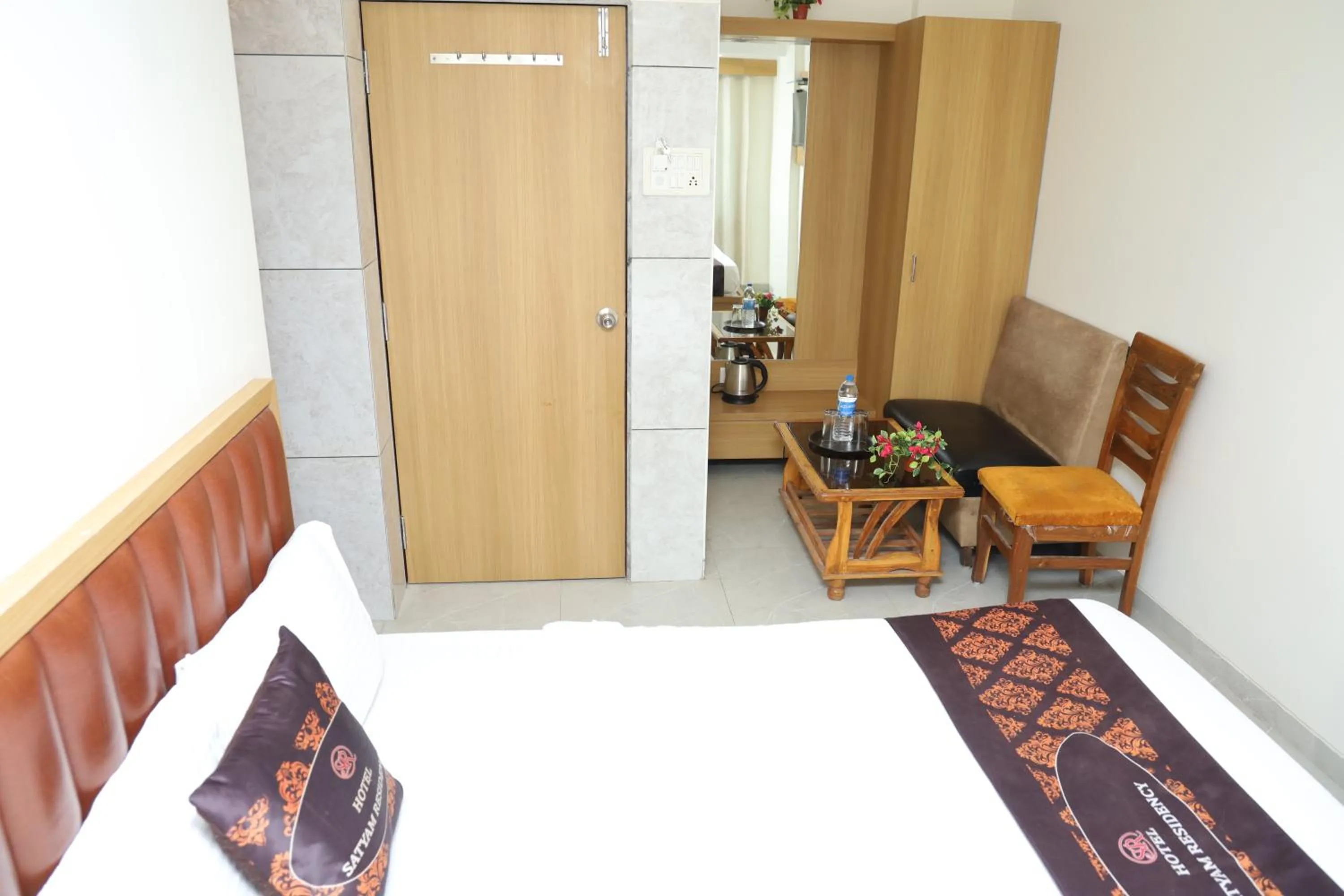 Bed in Hotel Satyam Residency