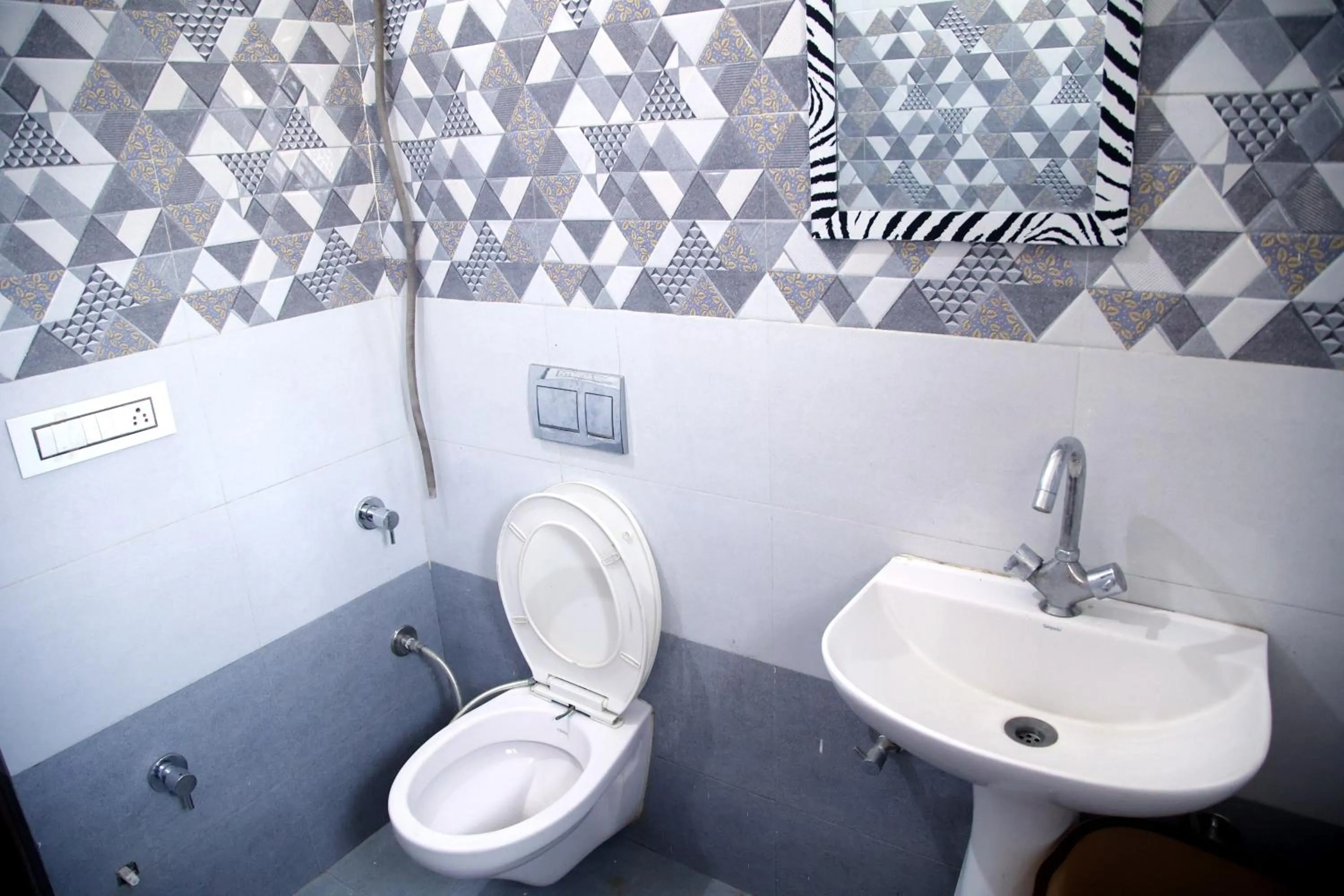 Bathroom in Hotel O Galaxy Stays