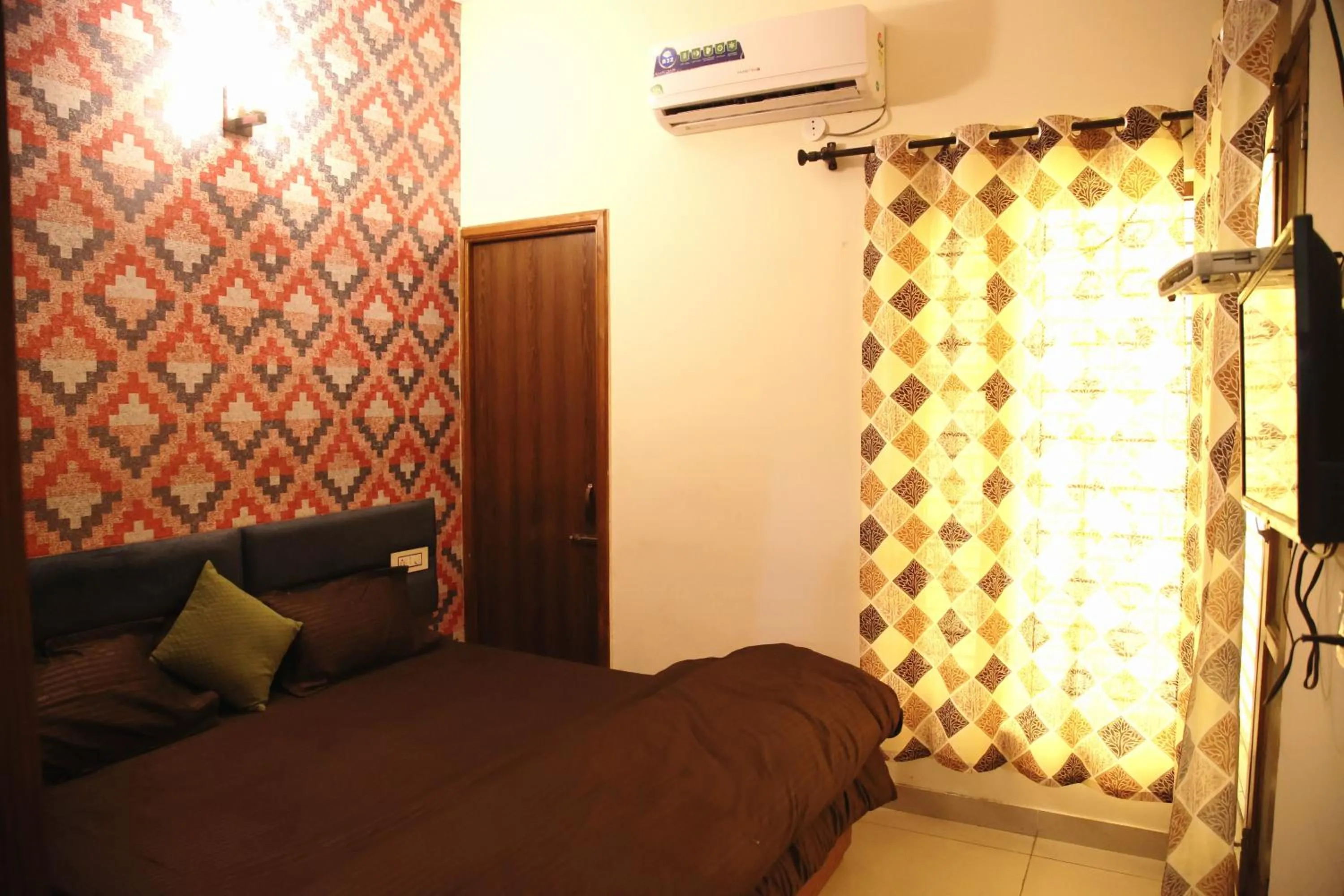 Bedroom in Hotel O Galaxy Stays