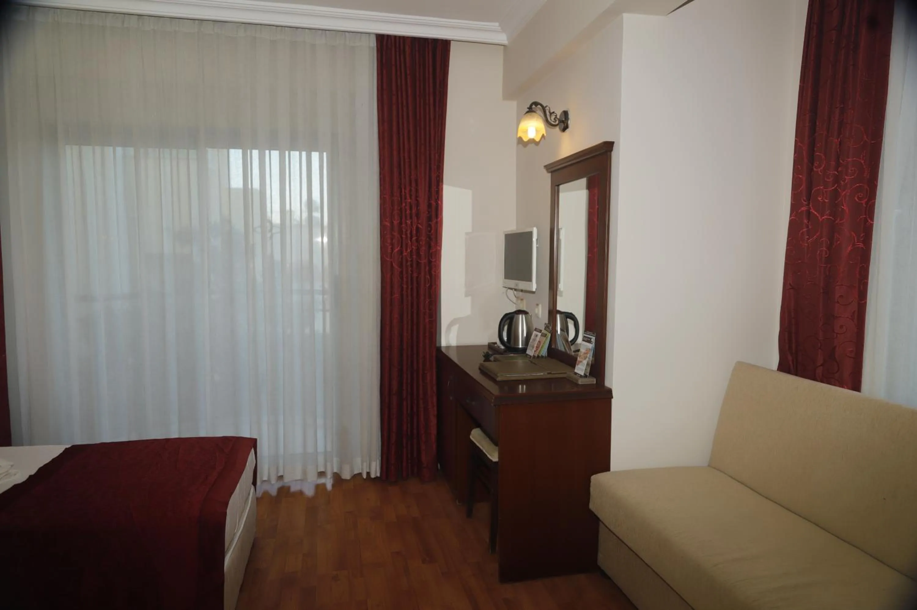 Seating area, Bed in STELLA HOTEL&Spa ALL INCLUSIVE