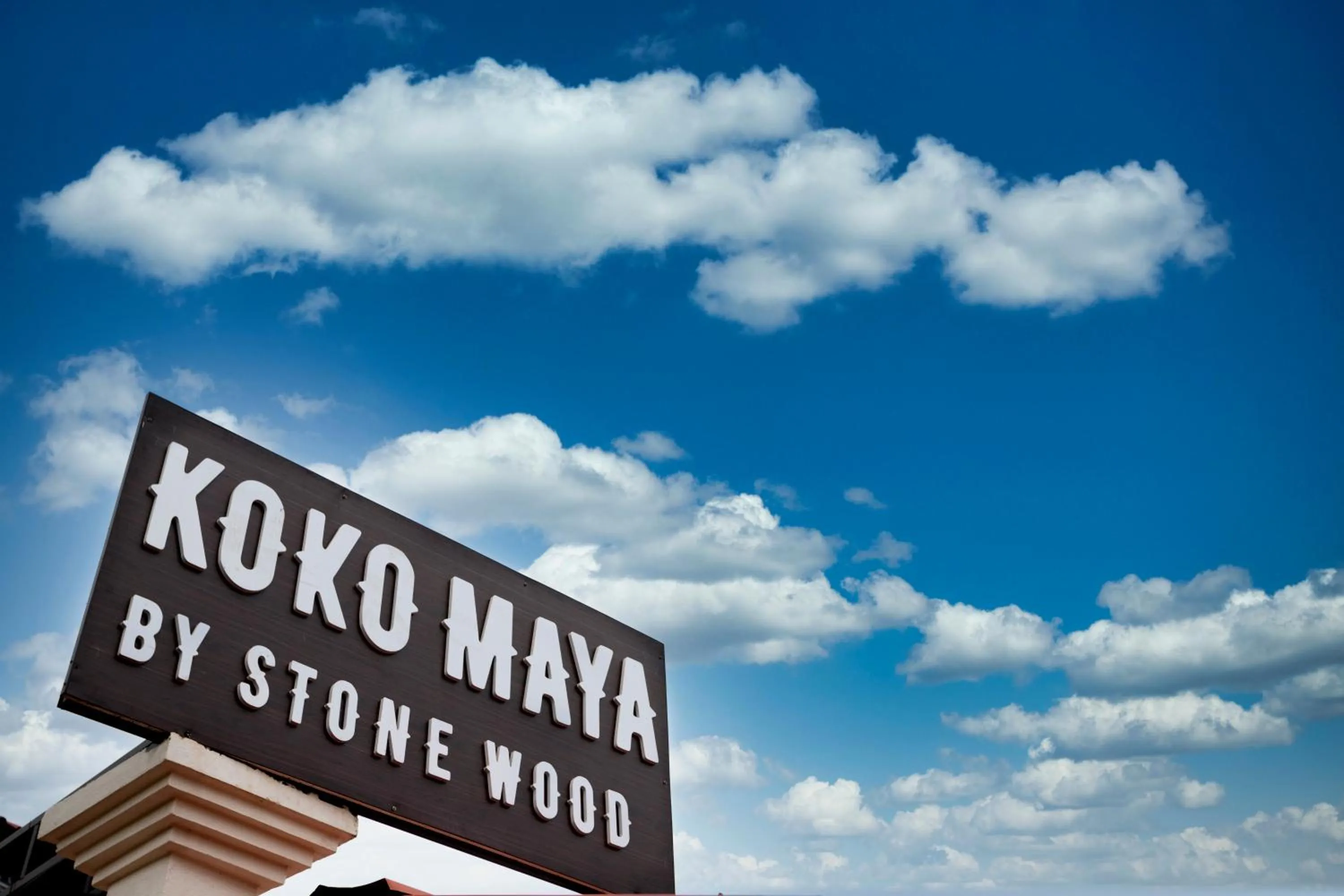 Text overlay in Koko Maya by Stone Wood Comfort