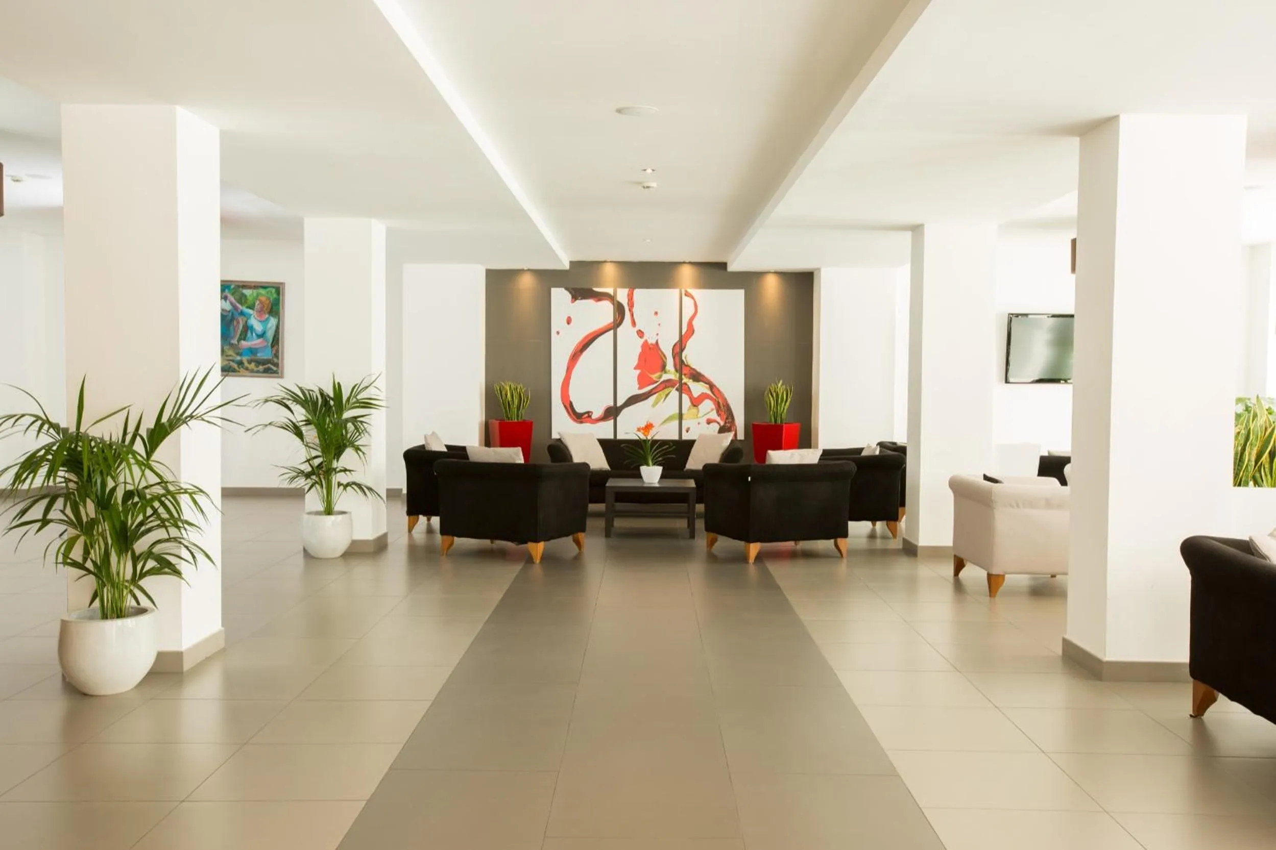 Communal lounge/ TV room in Toscana Ambassador