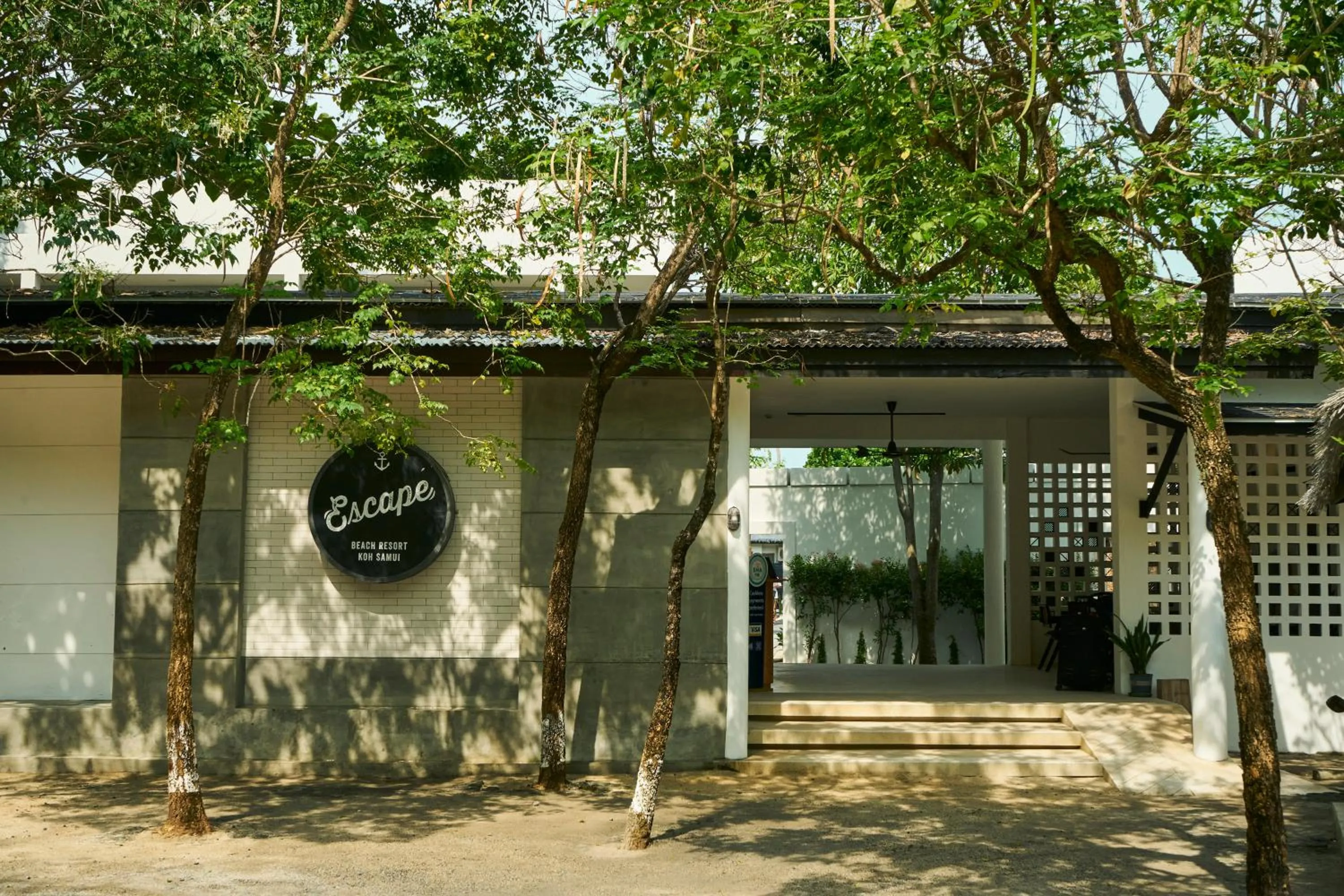 Property logo or sign in Escape Beach Resort - New Look & Improved