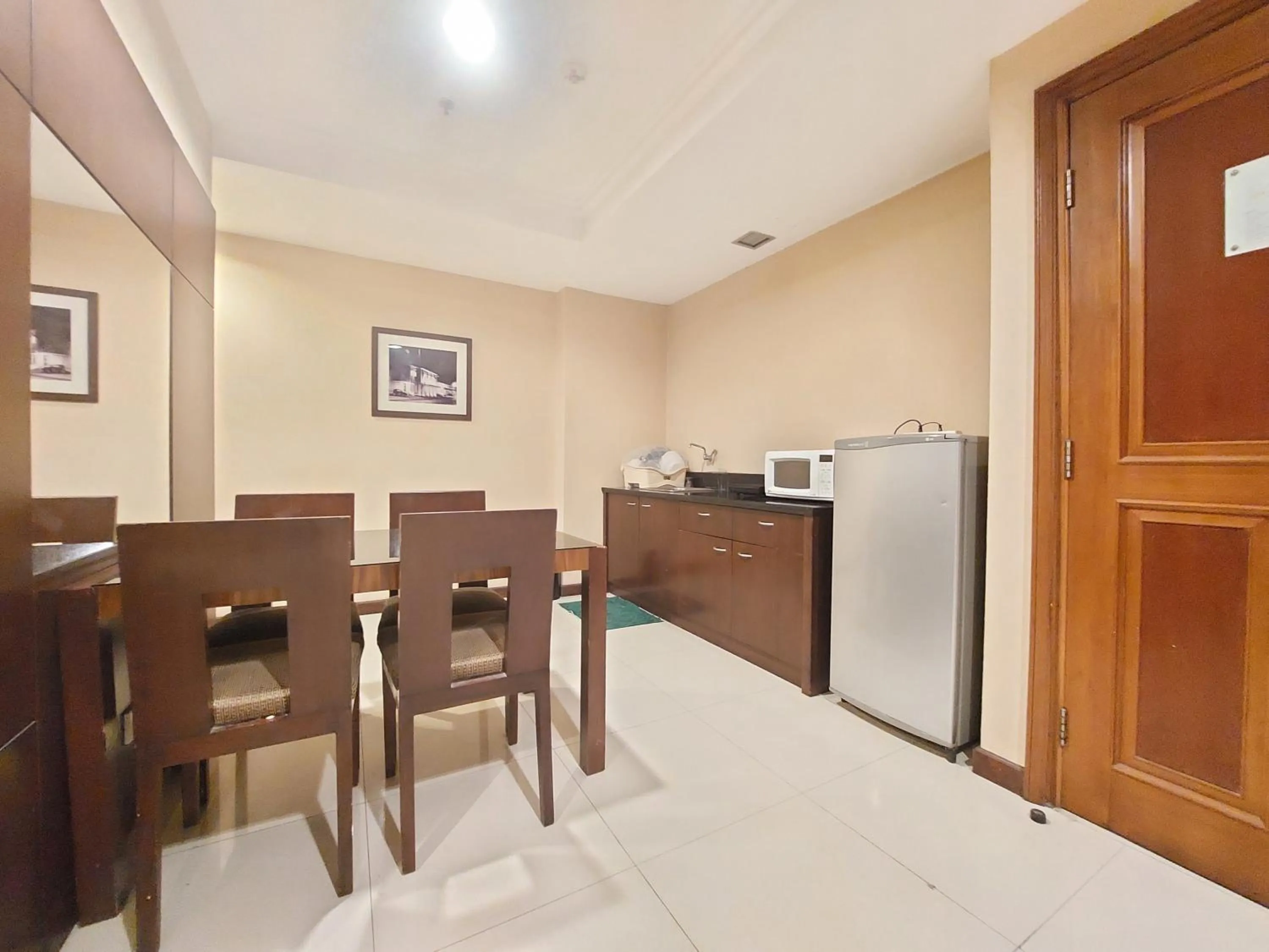 Dining area in High Livin Apartment Ciumbuleuit