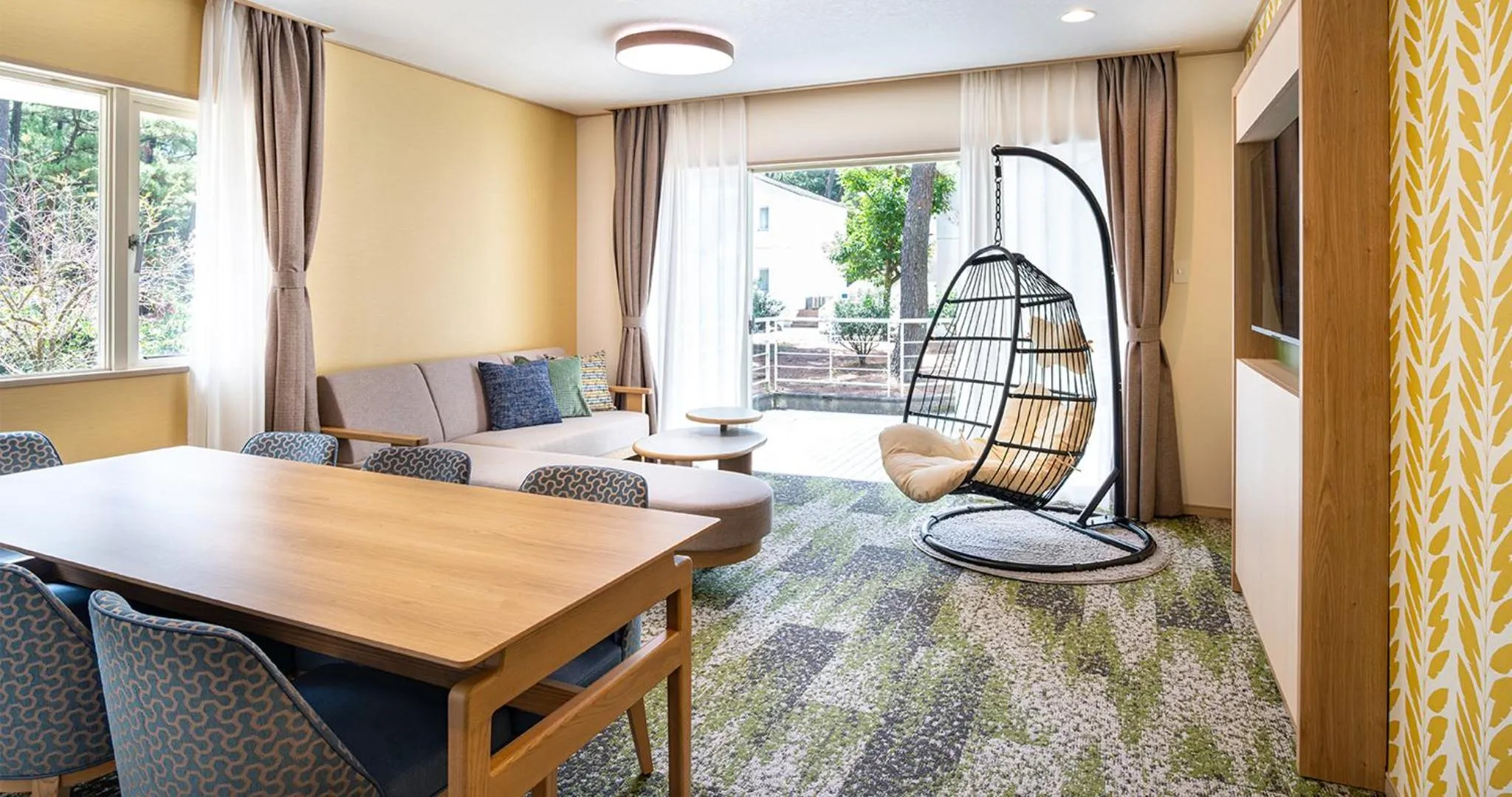 Living room, Bed in Seagaia Forest Cottages