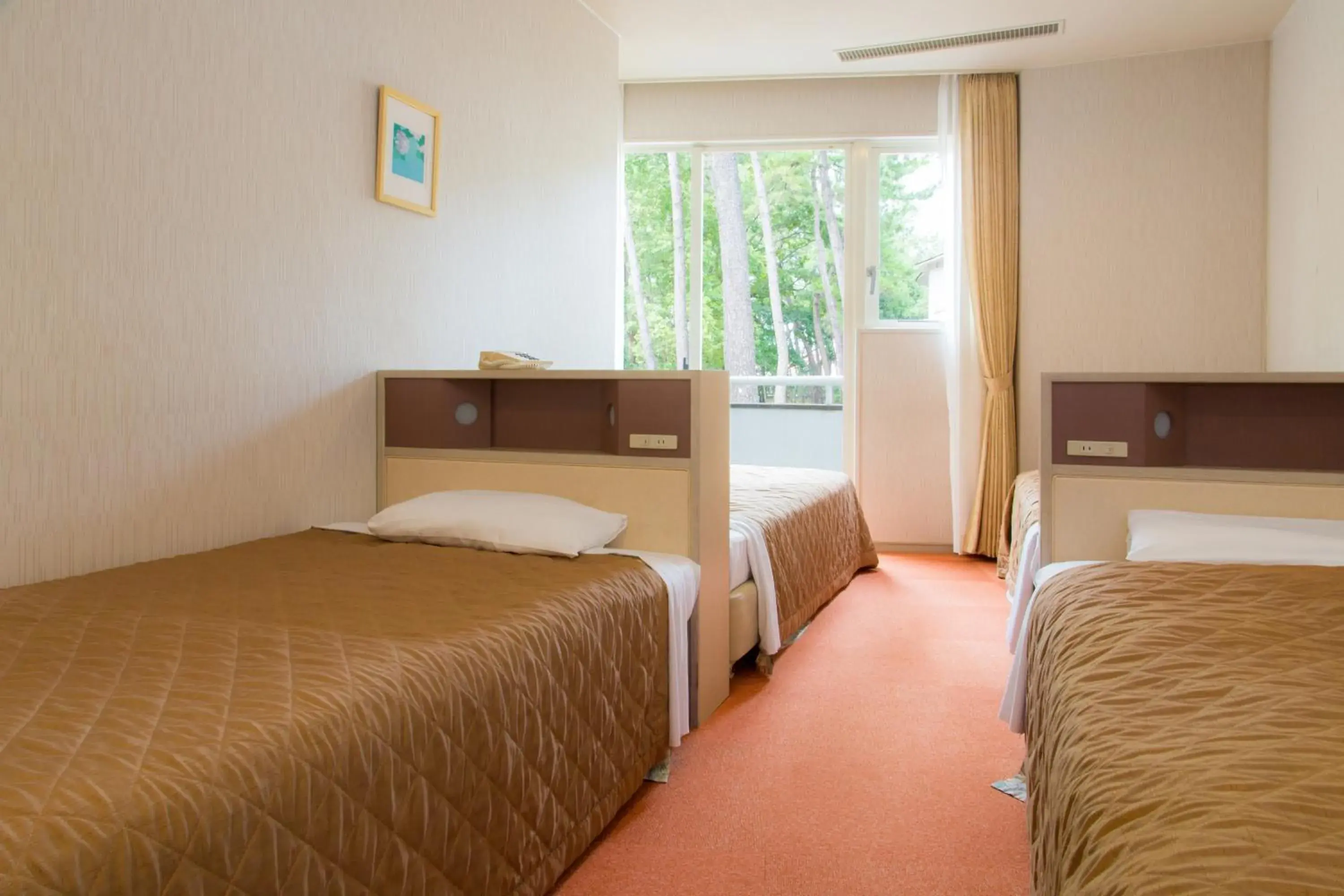 Bed in Seagaia Forest Cottages Bed in Seagaia Forest Cottages