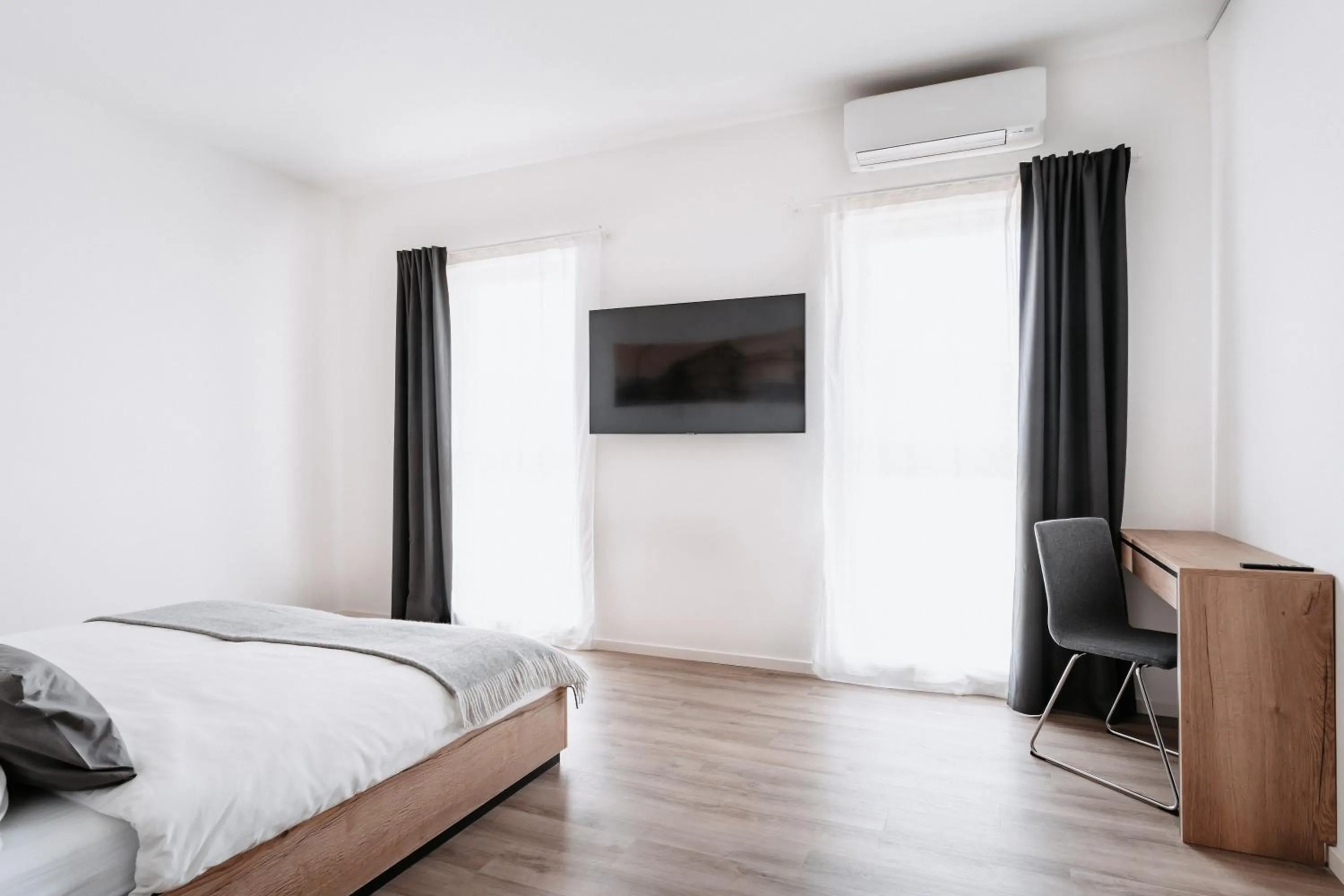 Bed in STEP INN The Fair Hotel