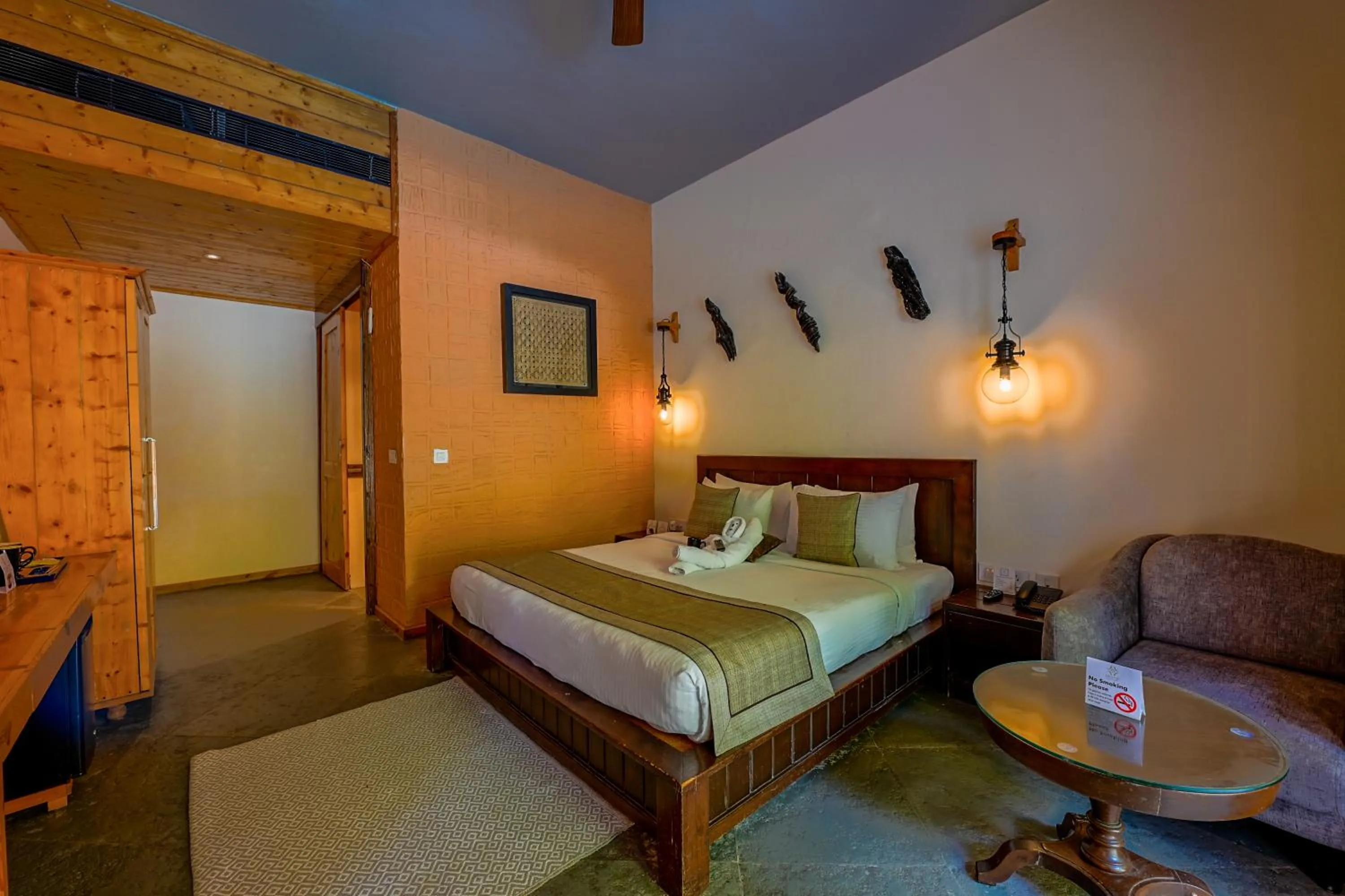 Bed in Tarangi Resort and Spa