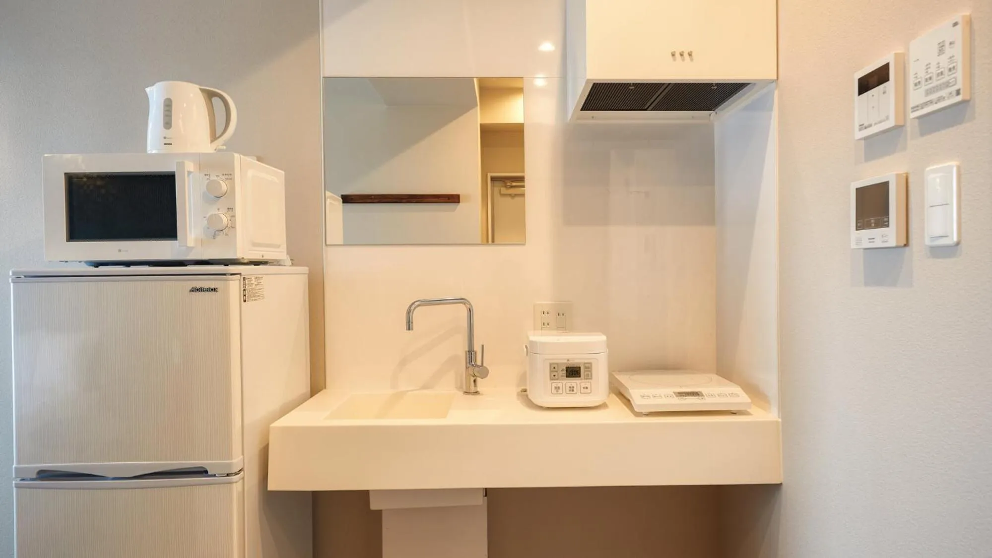 Kitchen or kitchenette in New Normal Condo in NAHA AIRPORT ニューノーマルコンドイン那覇エアポート