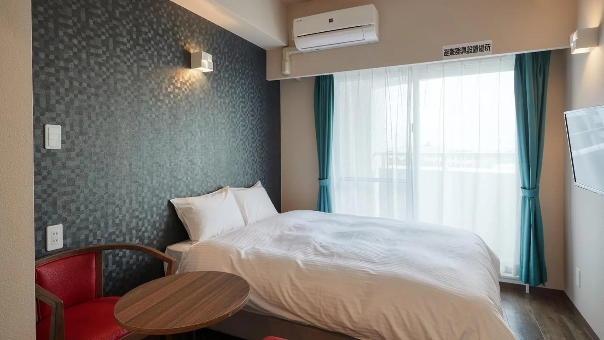 Bed in New Normal Condo in NAHA AIRPORT ニューノーマルコンドイン那覇エアポート