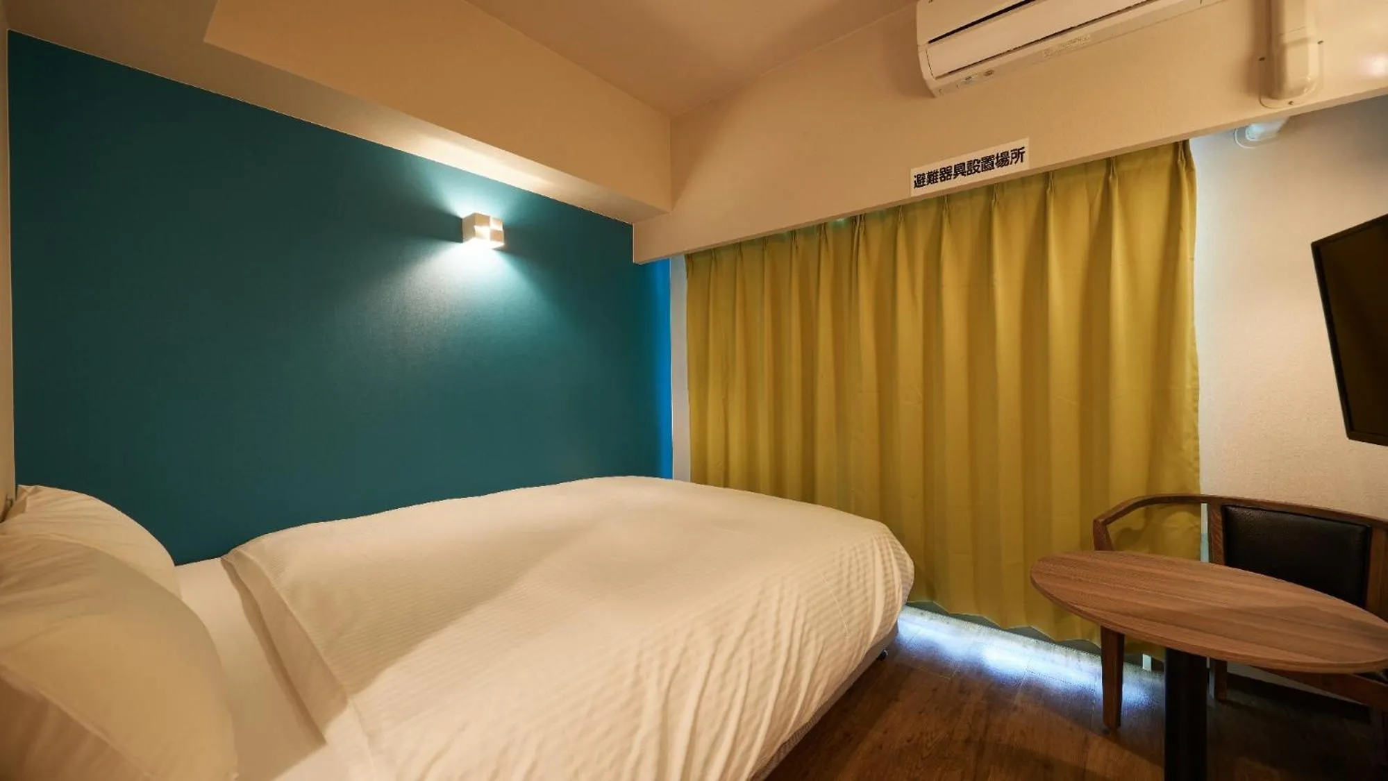 Bed in New Normal Condo in NAHA AIRPORT ニューノーマルコンドイン那覇エアポート