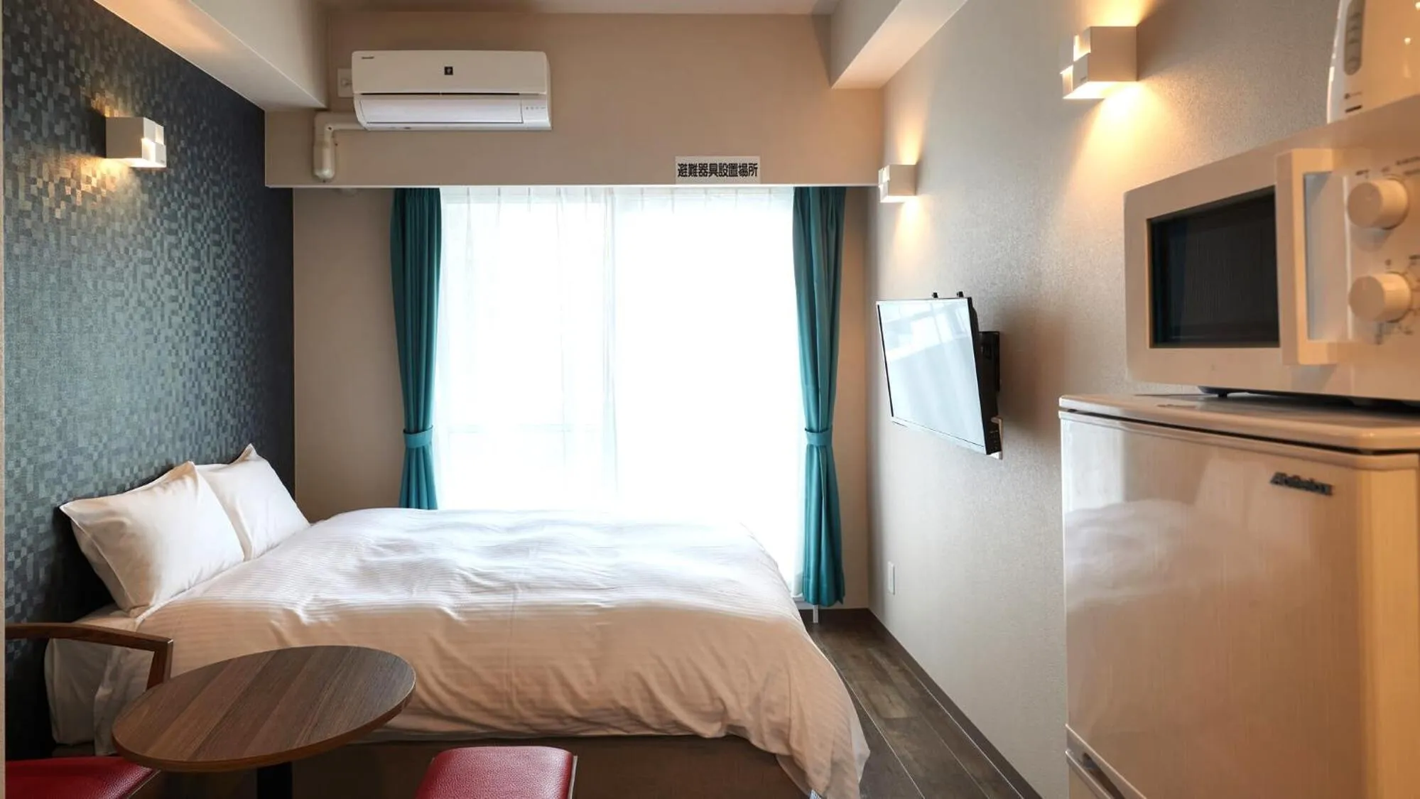 Bed in New Normal Condo in NAHA AIRPORT ニューノーマルコンドイン那覇エアポート