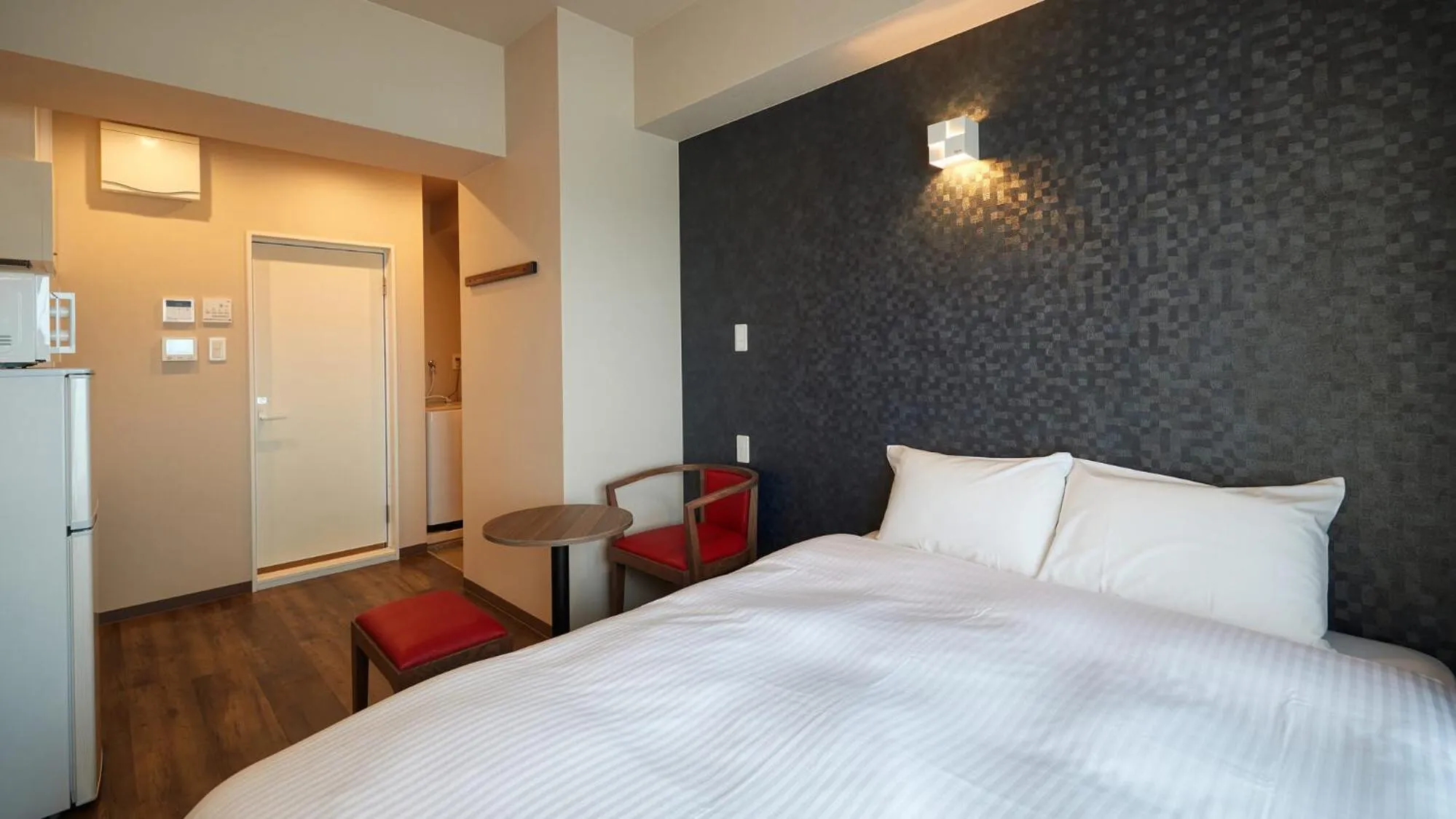 Bed in New Normal Condo in NAHA AIRPORT ニューノーマルコンドイン那覇エアポート