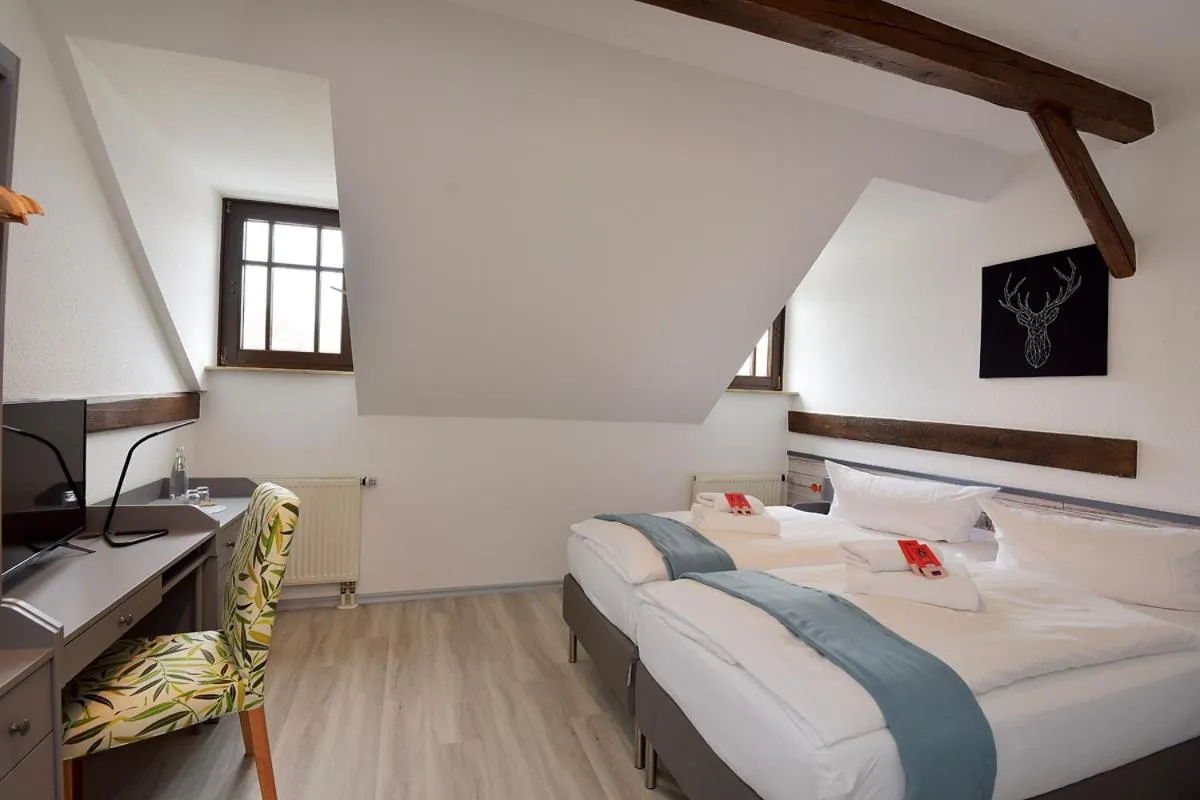 Photo of the whole room, Bed in Landhotel Der Distelhof mit Scheunencafé