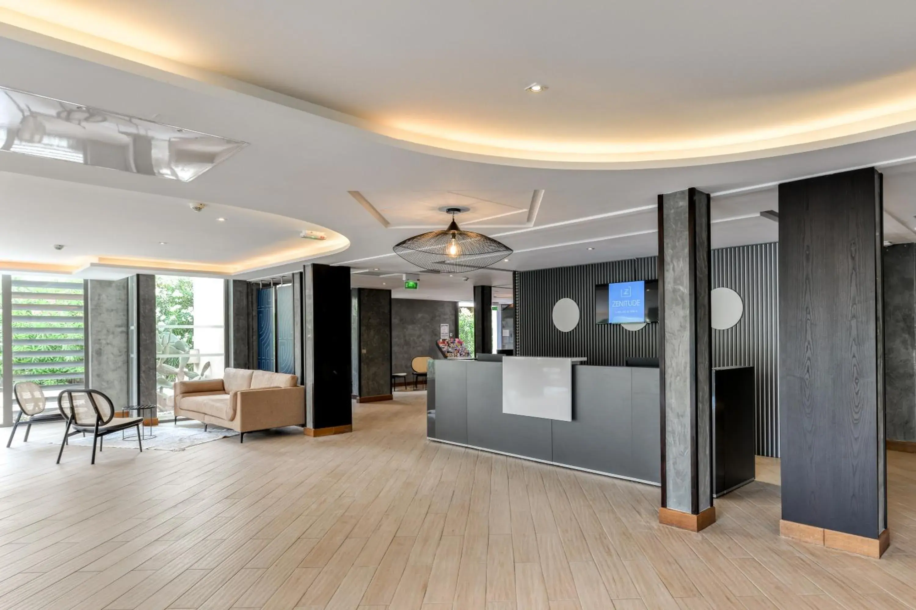 Lobby or reception in Zenitude Hotel la Valadière, an Ascend Collection Hotel Lobby or reception in Zenitude Hotel la Valadière, an Ascend Collection Hotel