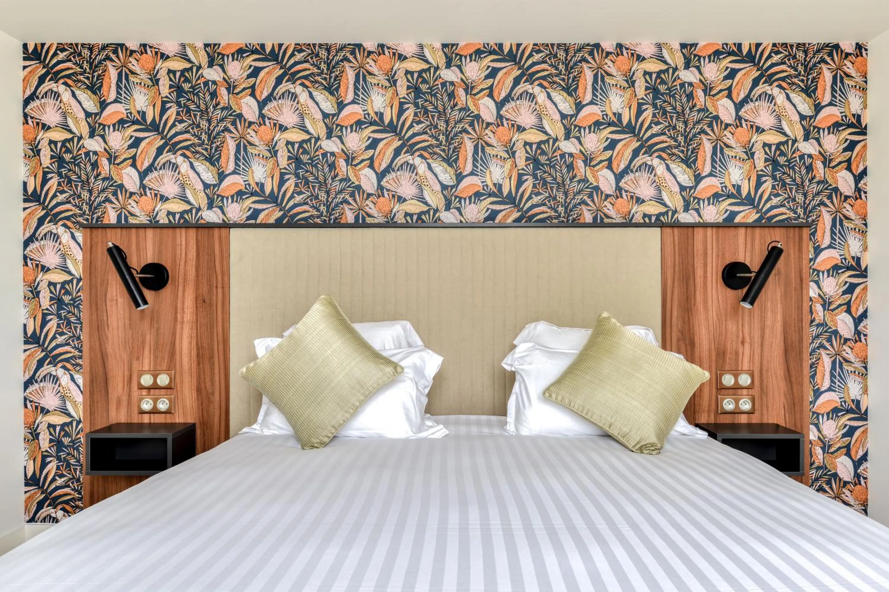 Bed in Zenitude Hotel La Valadière, Ascend Hotel Collection