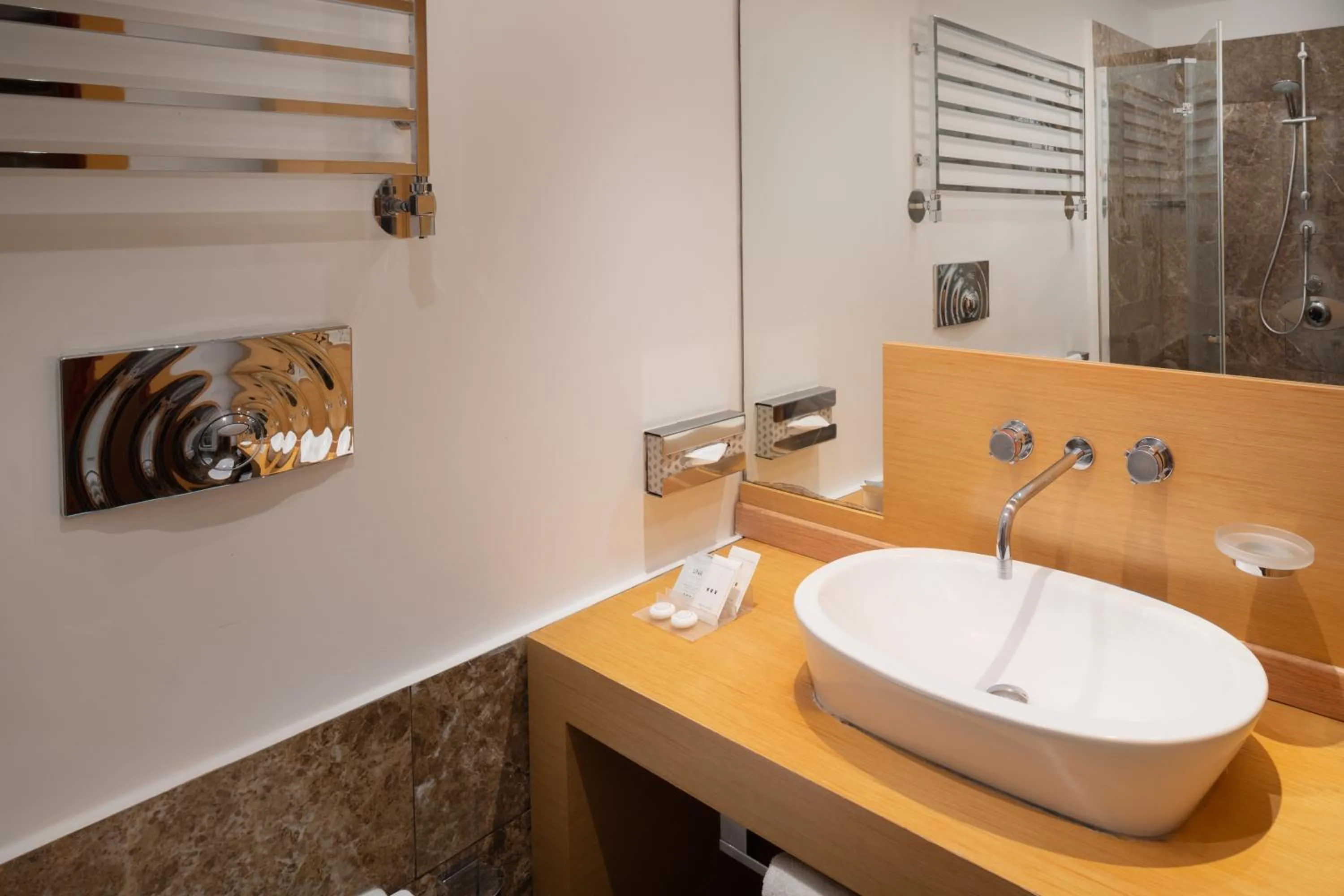 Bathroom in UNA Hotels Napoli