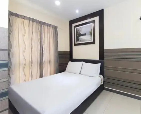 Bed in Hotel Seniman