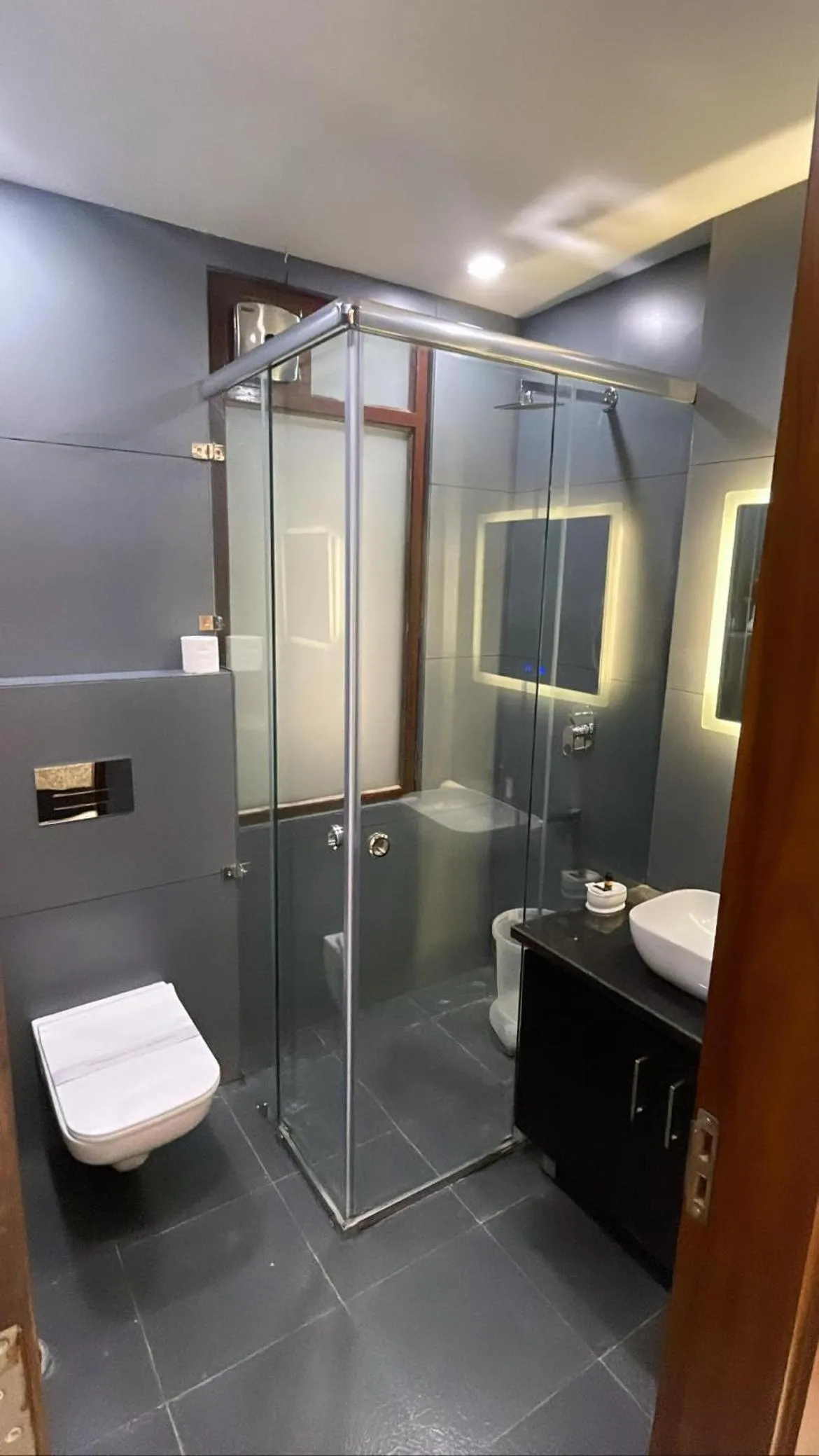 Bathroom in Hotel Malbork Inn Rajouri Garden Delhi - Couple Friendly Local IDs Accepted