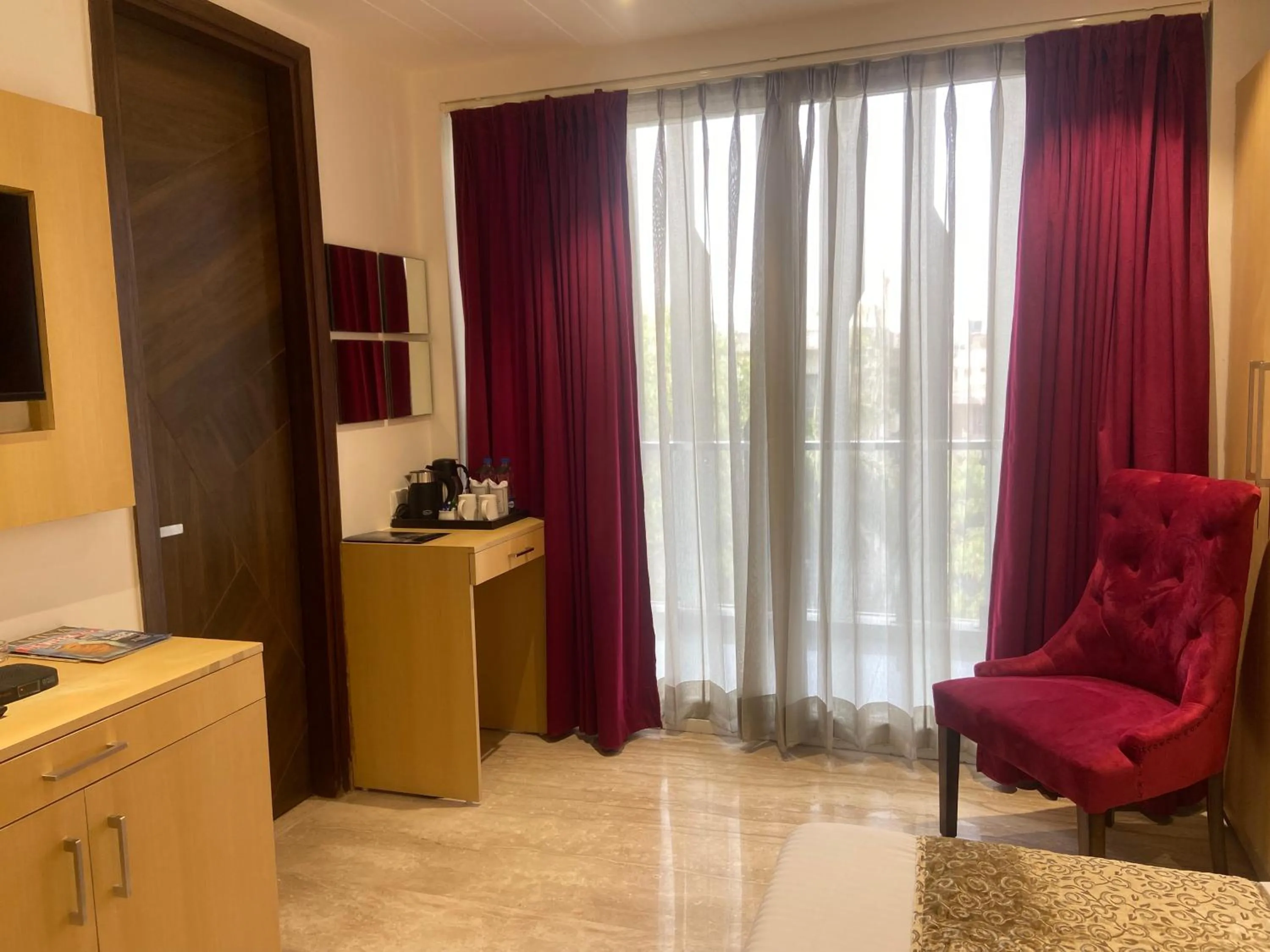 Communal lounge/ TV room in Hotel Malbork Inn Rajouri Garden Delhi - Couple Friendly Local IDs Accepted