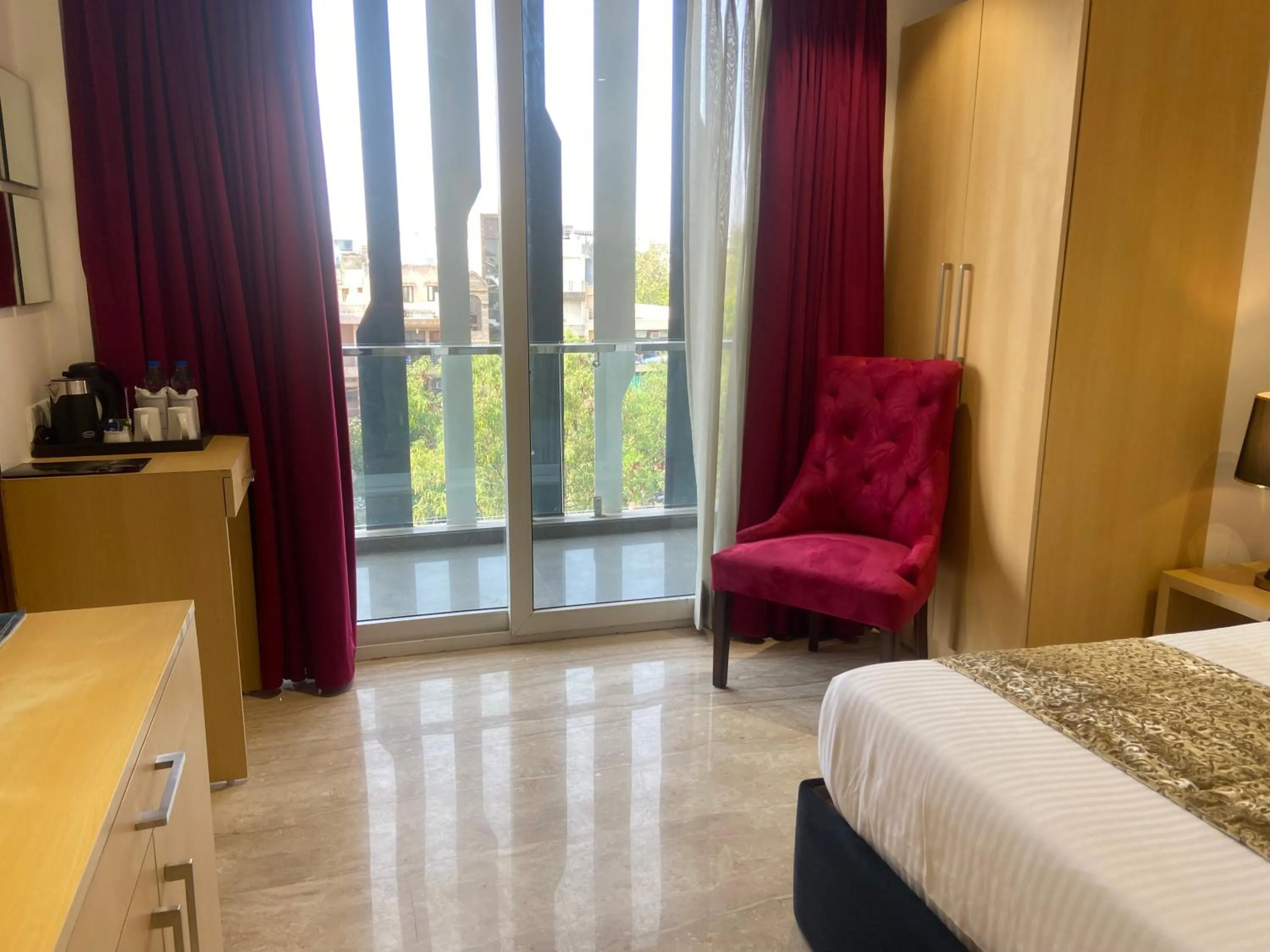 Living room, Bed in Hotel Malbork Inn Rajouri Garden Delhi - Couple Friendly Local IDs Accepted