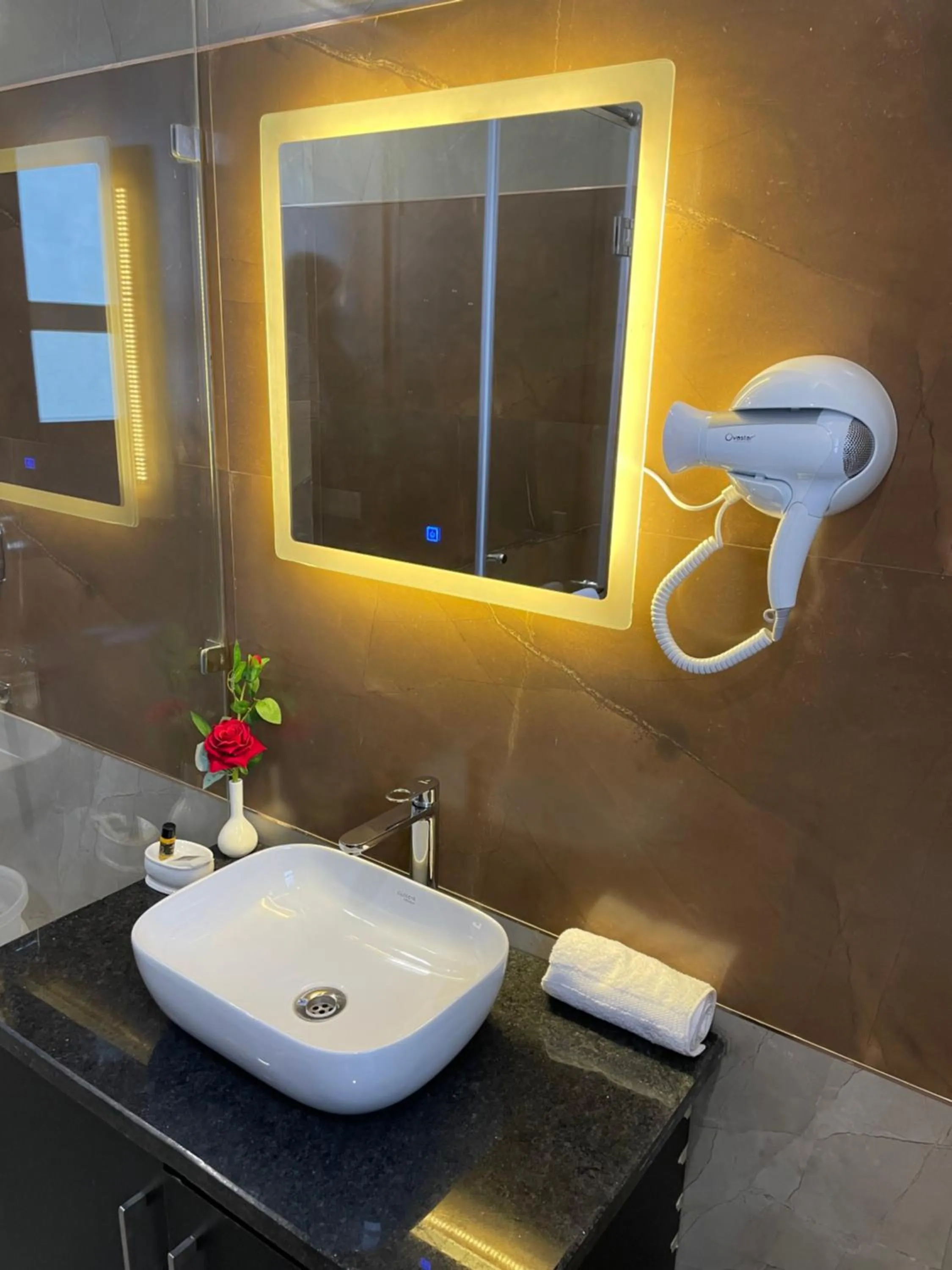 Bathroom in Hotel Malbork Inn Rajouri Garden Delhi - Couple Friendly Local IDs Accepted