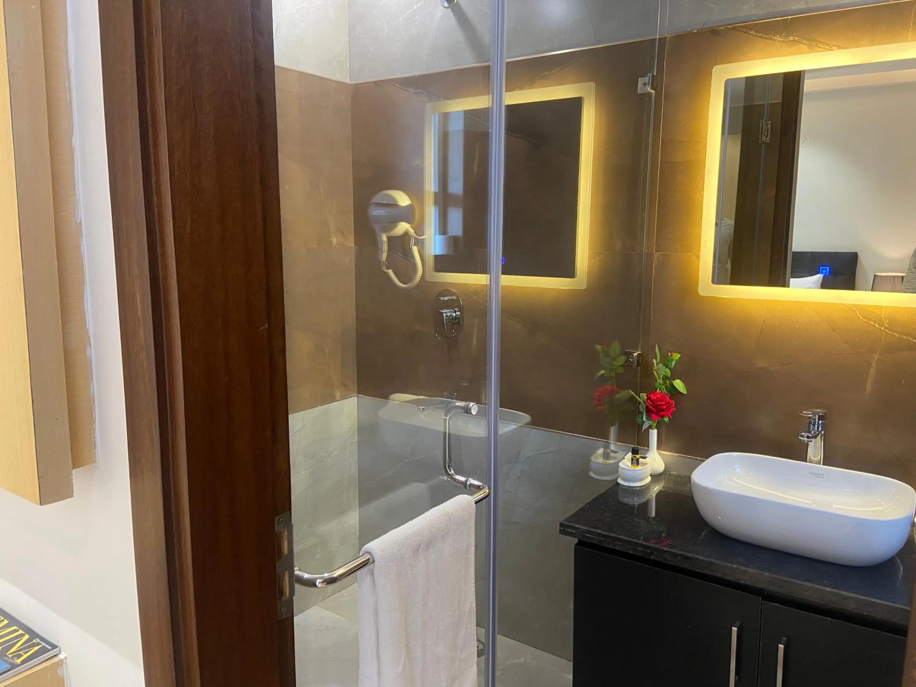 Bathroom in Hotel Malbork Inn Rajouri Garden Delhi - Couple Friendly Local IDs Accepted