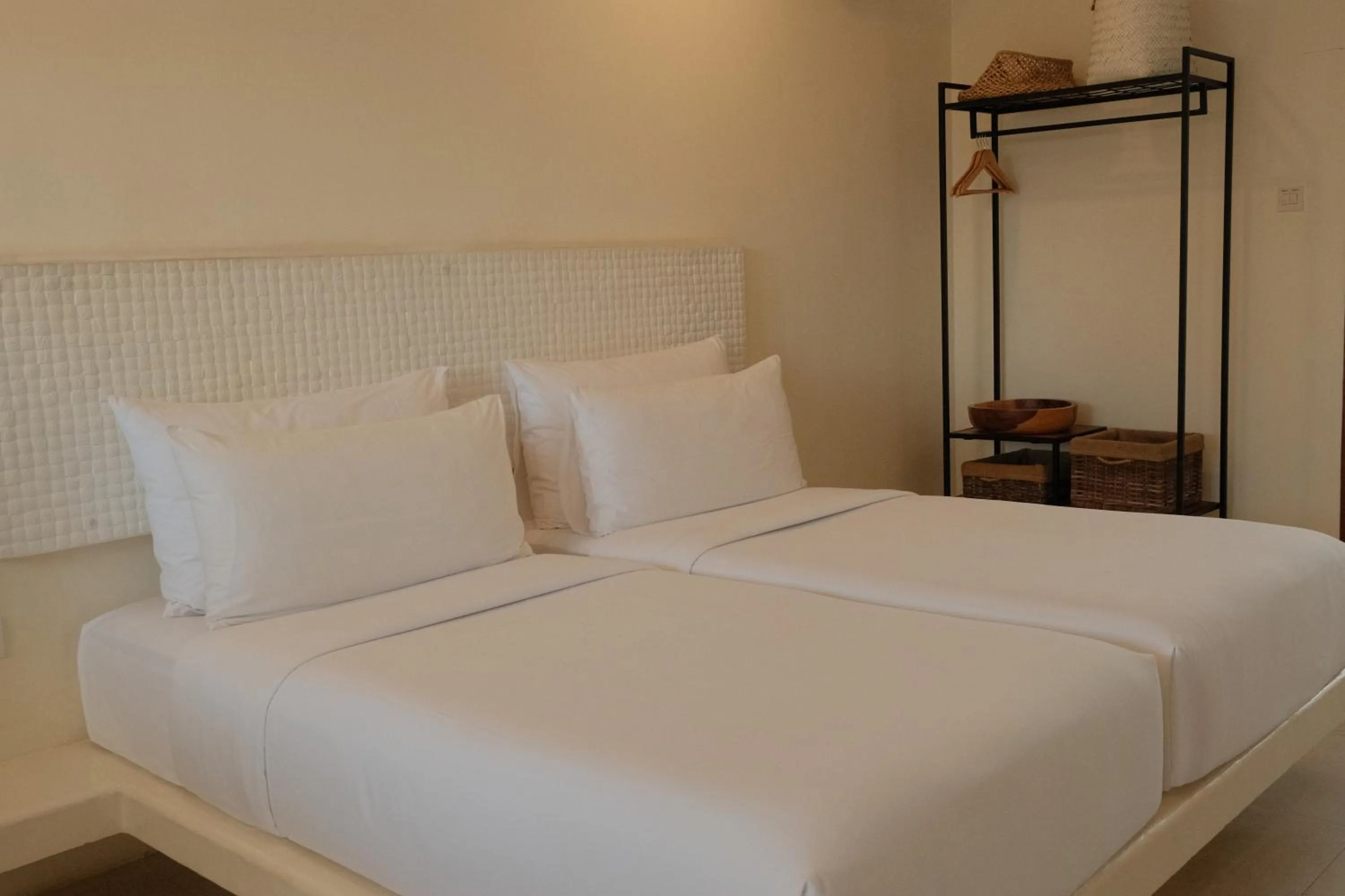 Bed in El Tropico Boutique Hotel