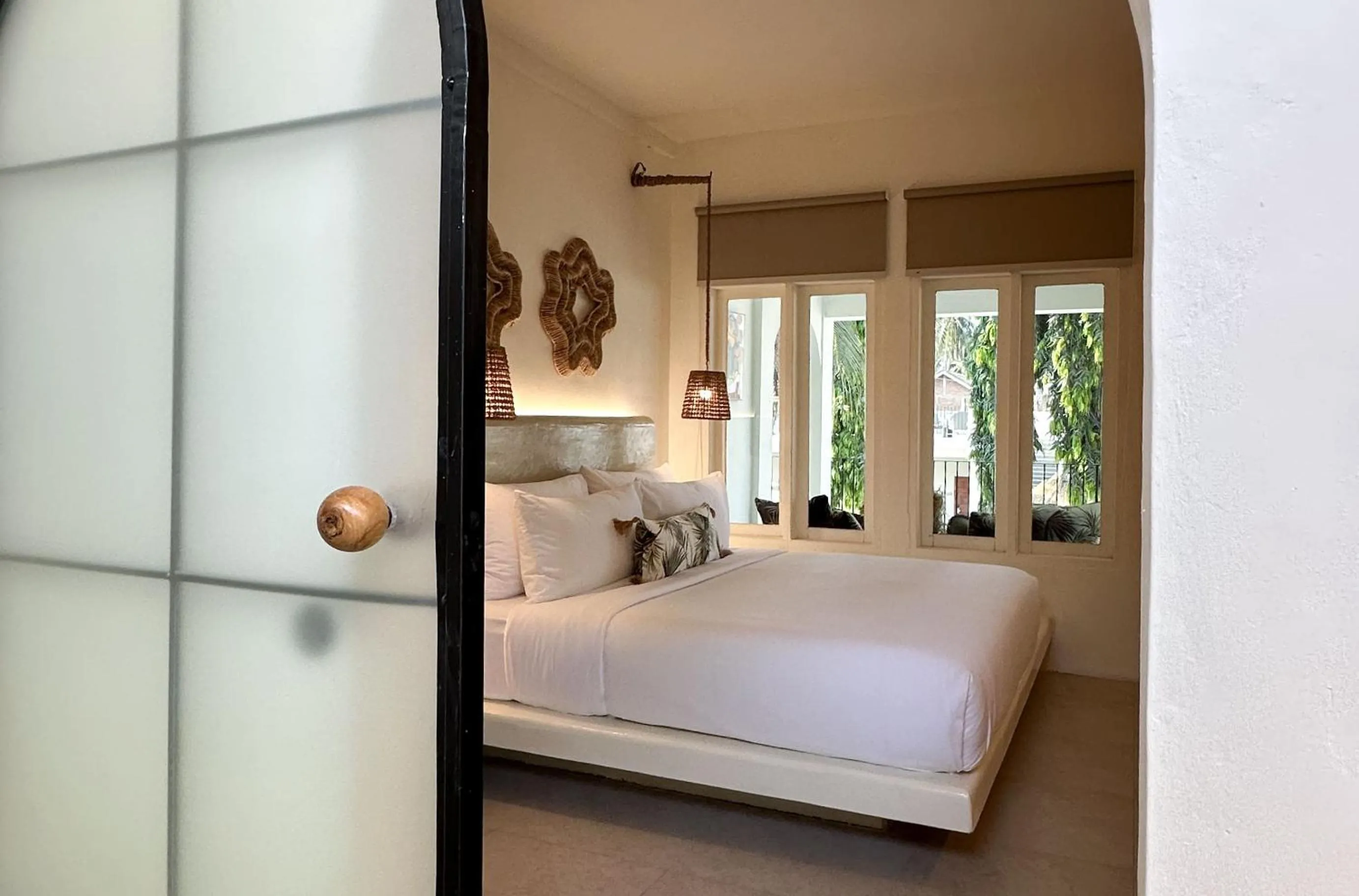 Bed in El Tropico Boutique Hotel