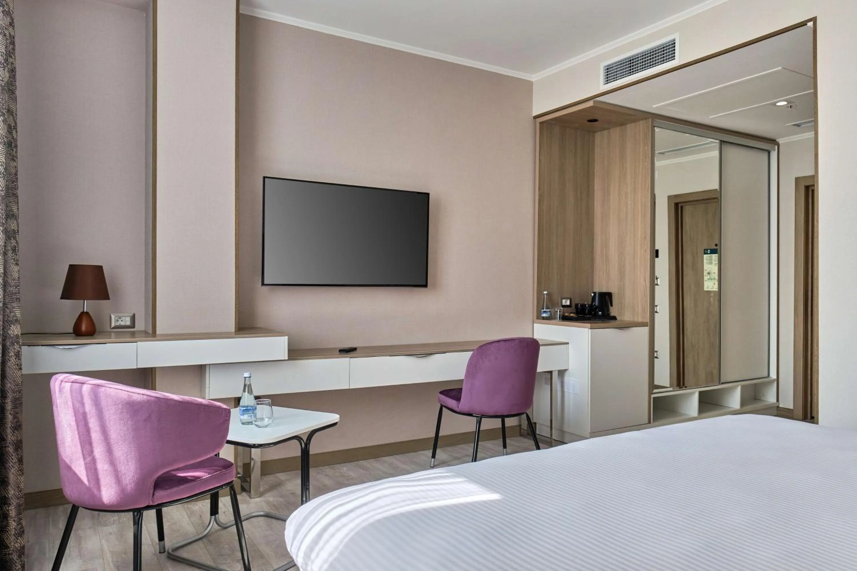 Living room, Bed in Panarams Tashkent Hotel, a member of Radisson Individuals