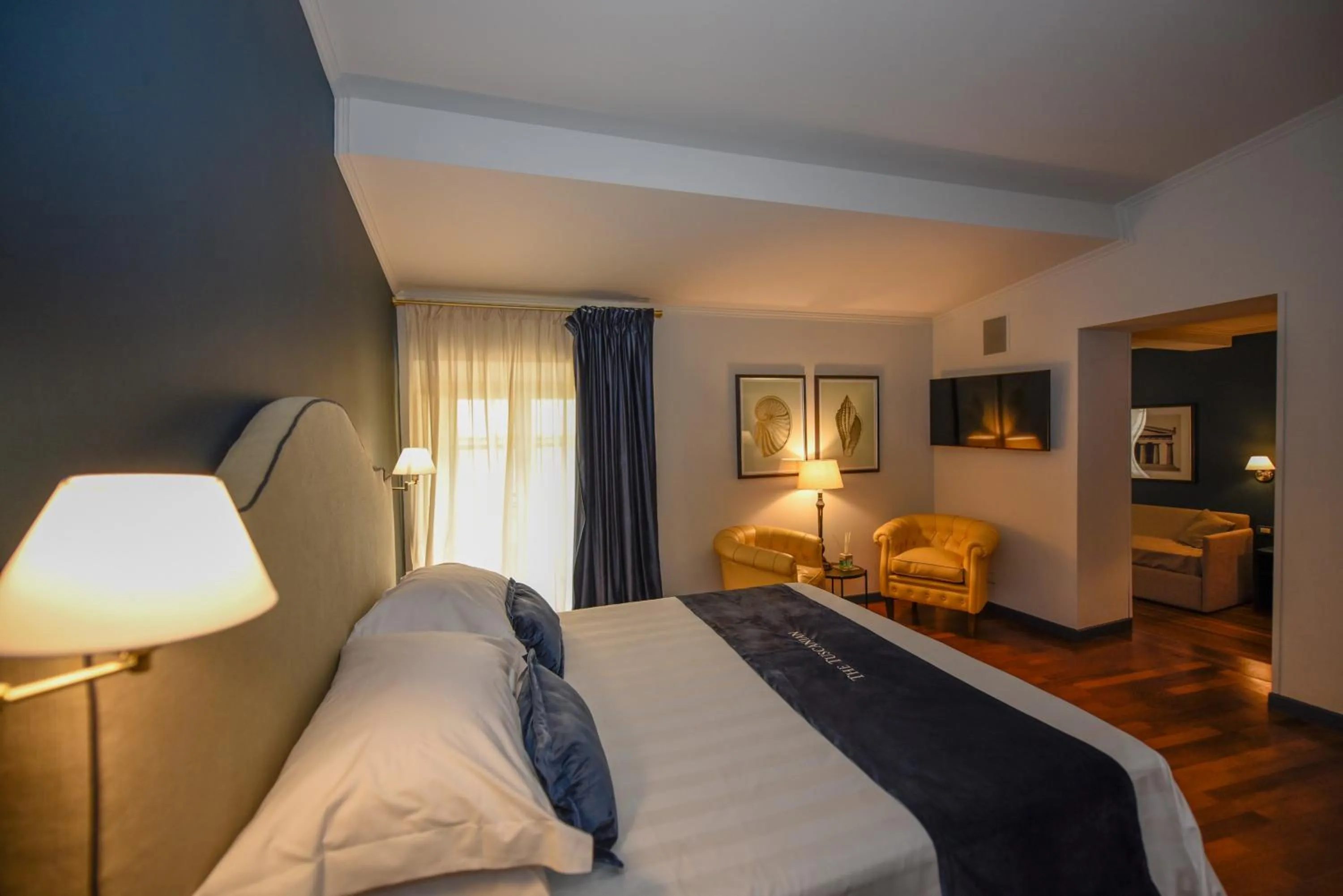 Photo of the whole room, Bed in The Tuscanian Hotel