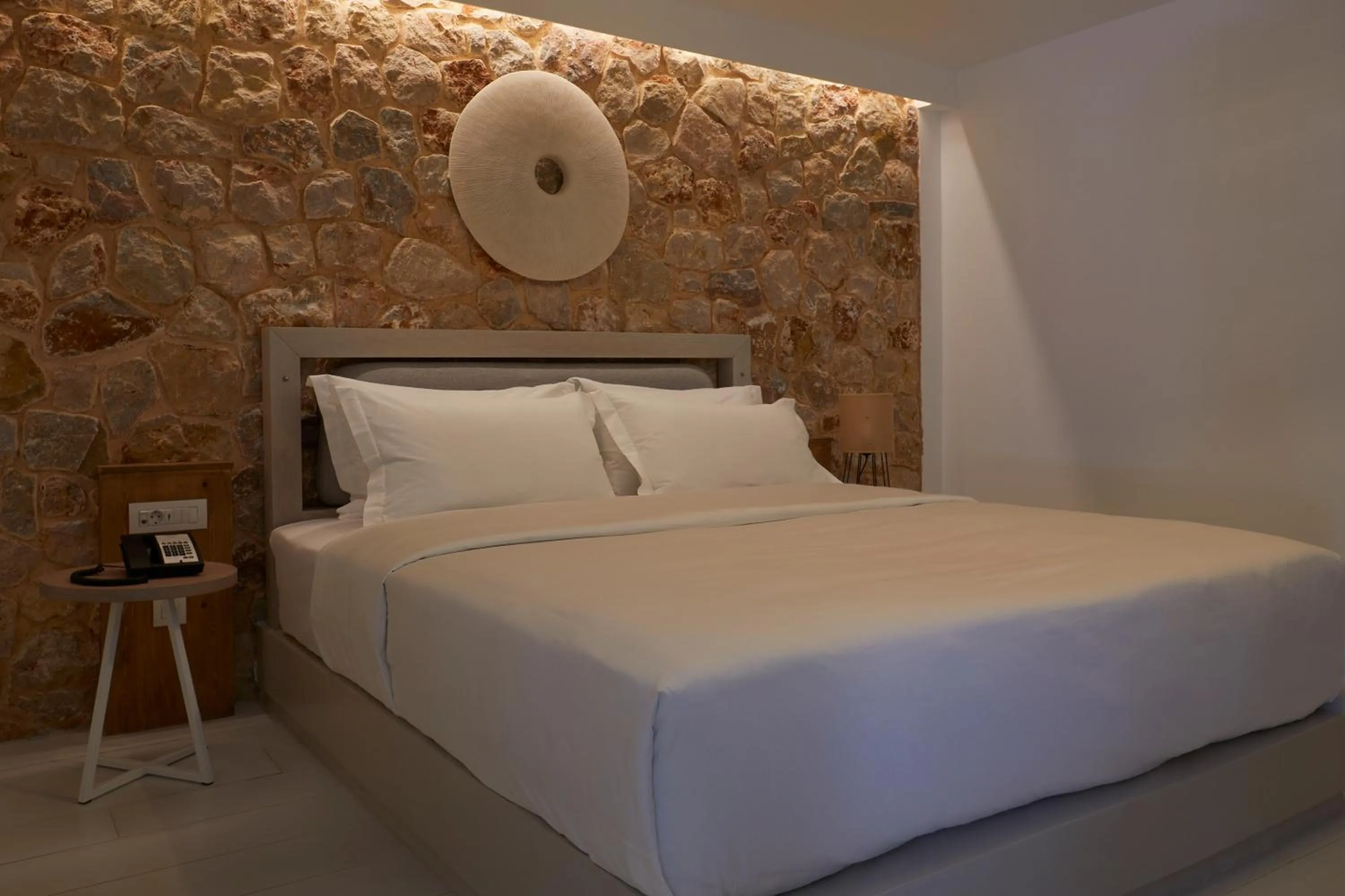 Bed in Sea Breeze Santorini Beach Resort, Curio By Hilton