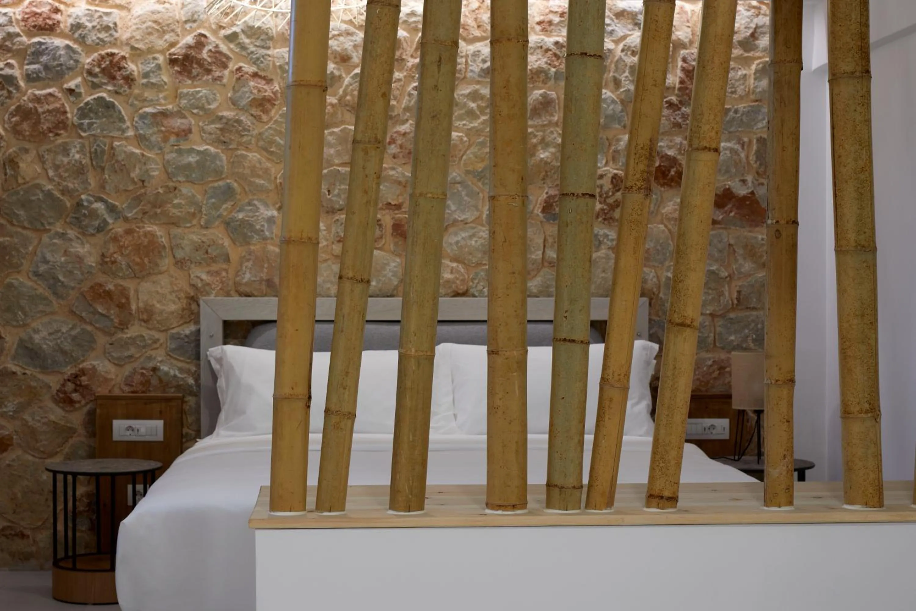 Bed in Sea Breeze Santorini Beach Resort, Curio By Hilton