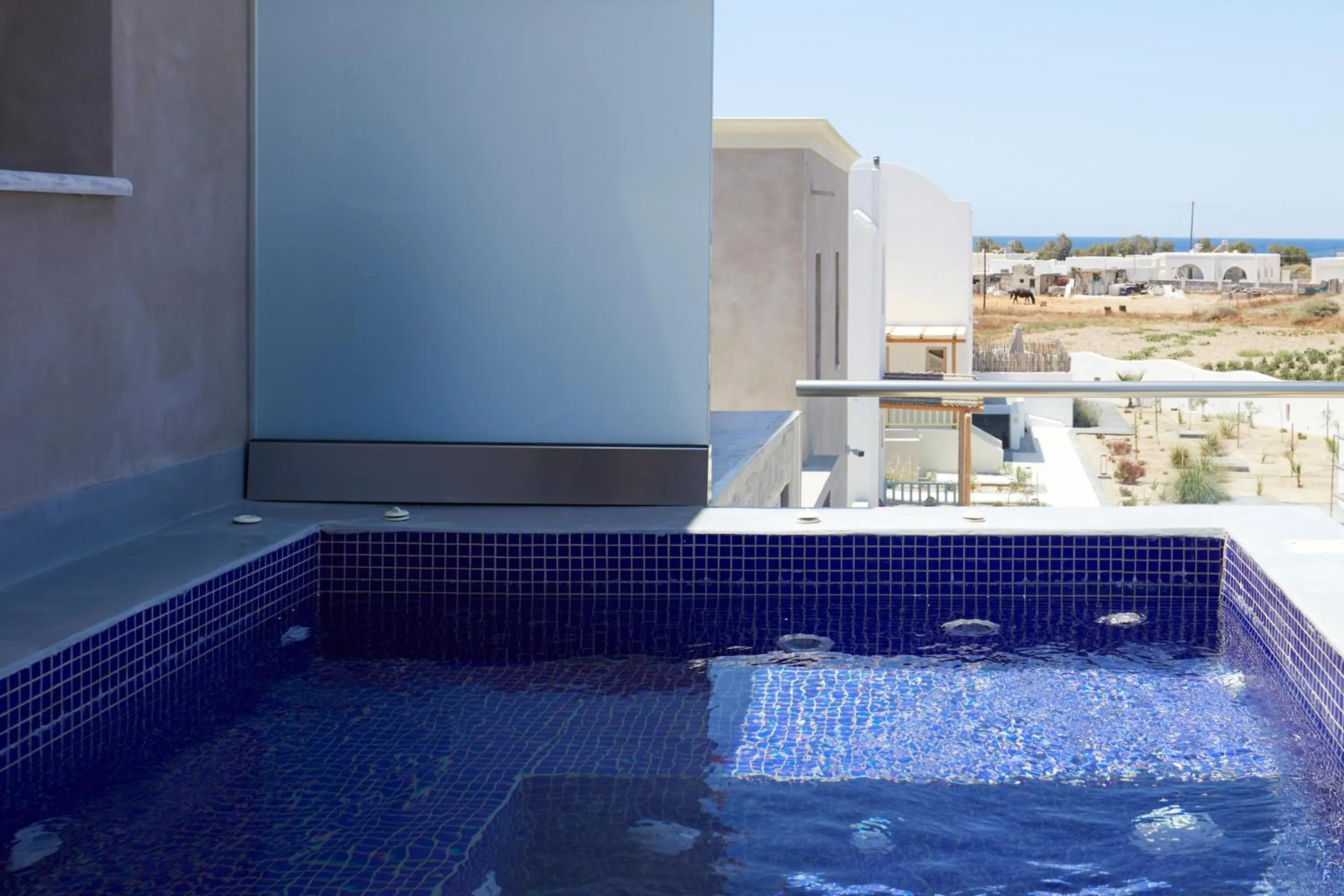 Hot Tub in Sea Breeze Santorini Beach Resort, Curio By Hilton
