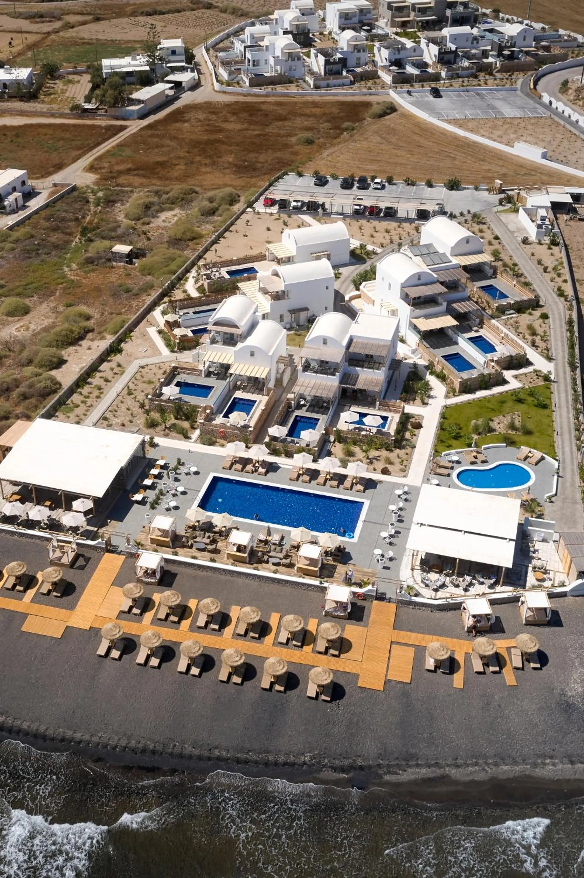 Property building in Sea Breeze Santorini Beach Resort, Curio By Hilton