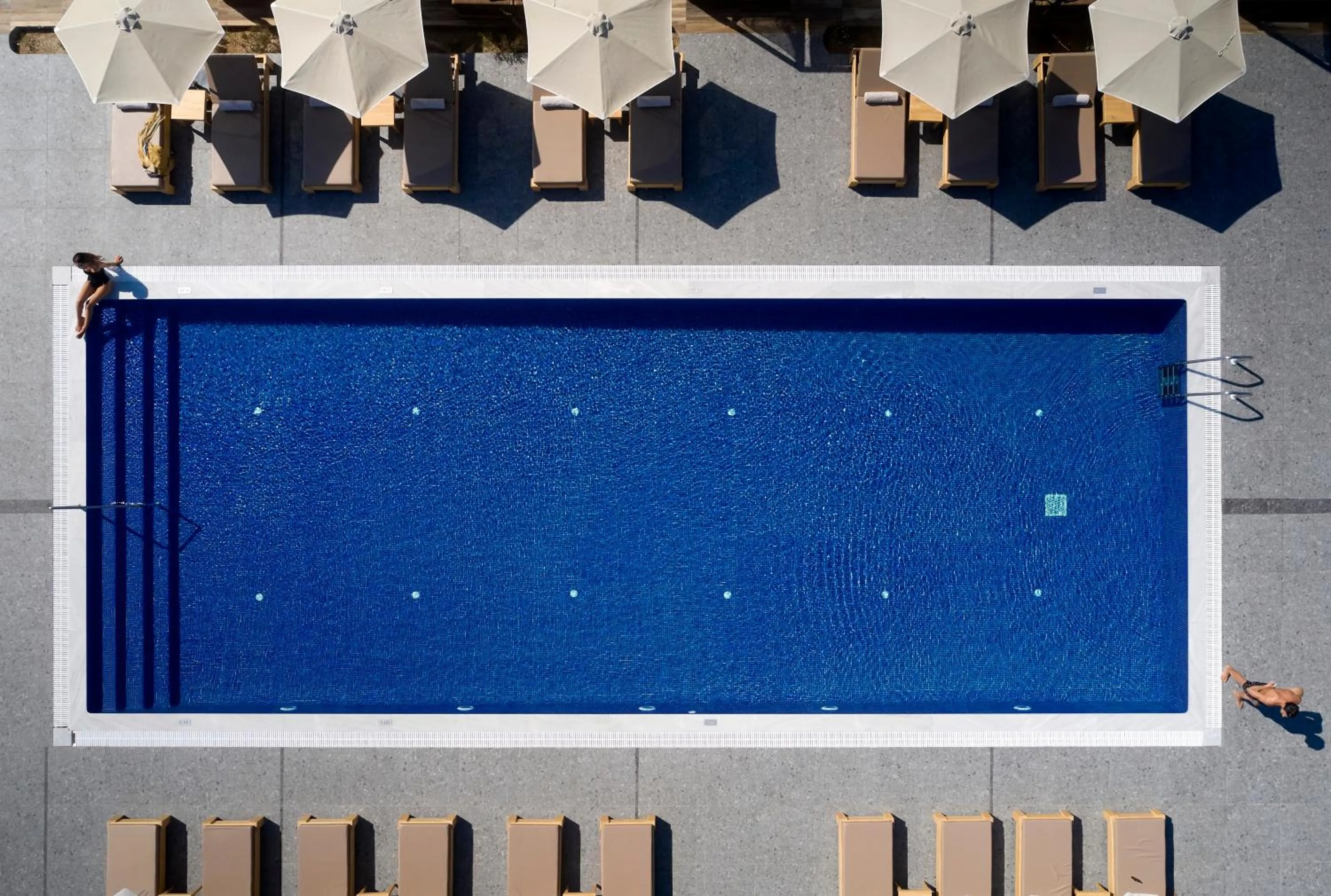 Pool view in Sea Breeze Santorini Beach Resort, Curio By Hilton
