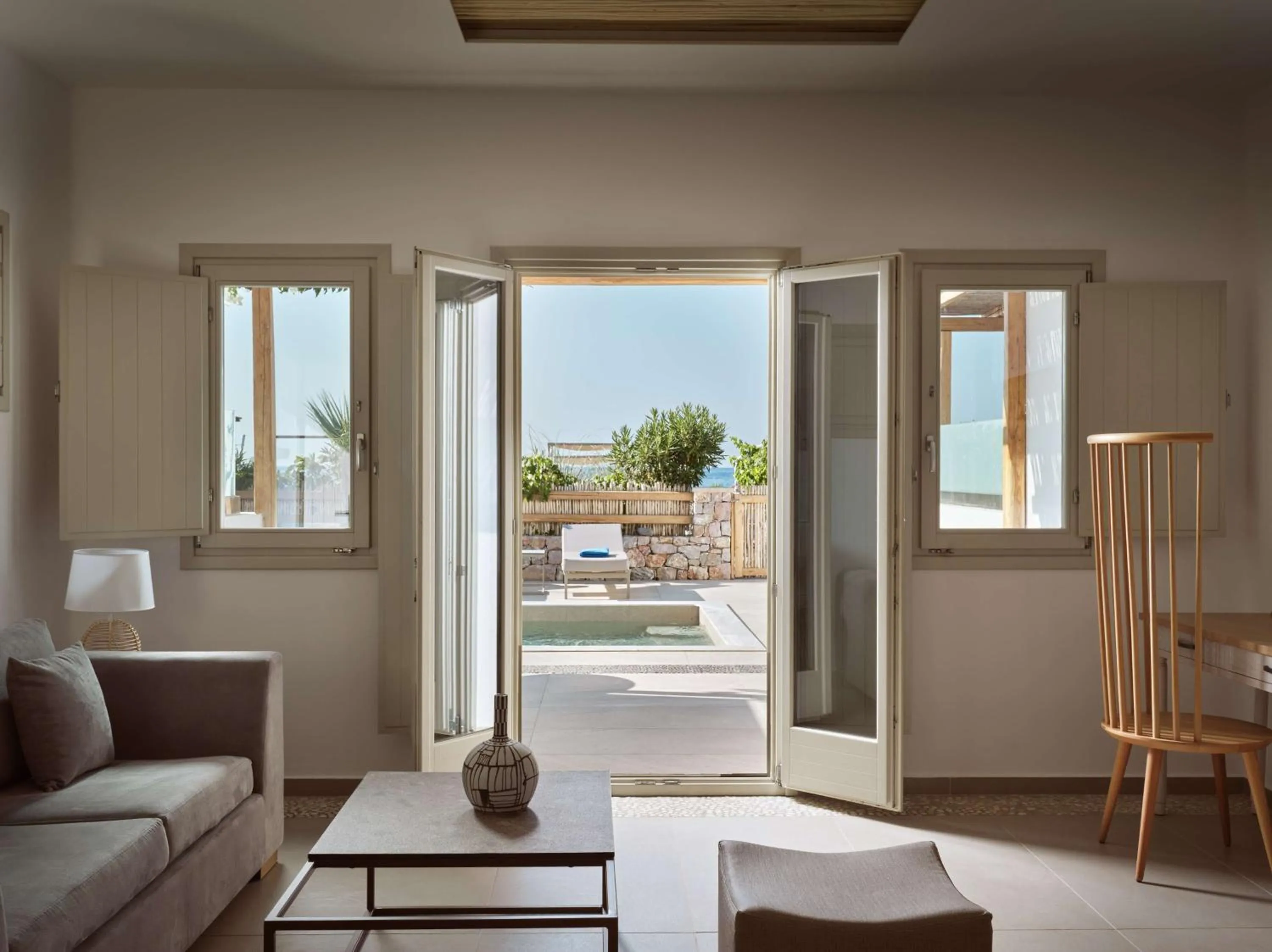 Living room in Sea Breeze Santorini Beach Resort, Curio By Hilton