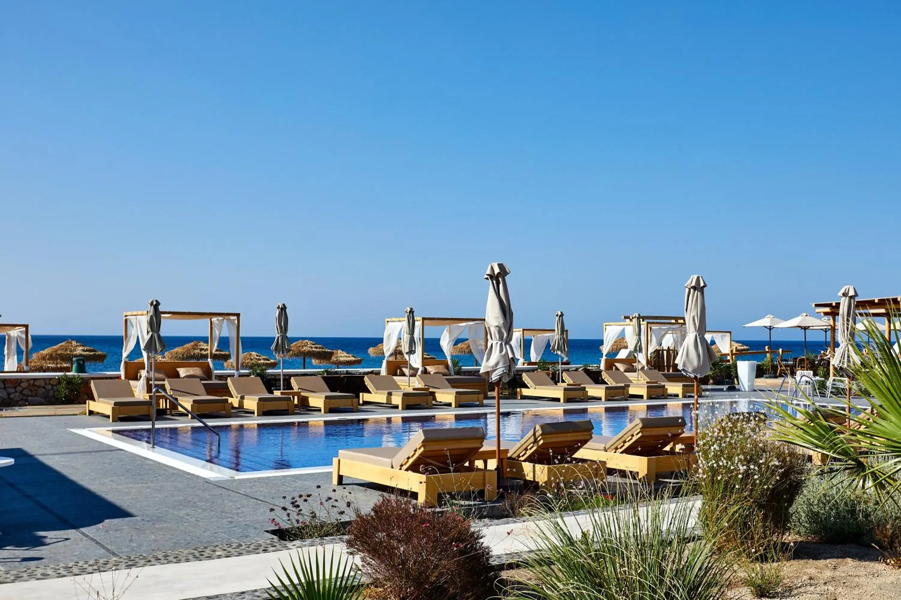 Swimming pool in Sea Breeze Santorini Beach Resort, Curio By Hilton Swimming pool in Sea Breeze Santorini Beach Resort, Curio By Hilton