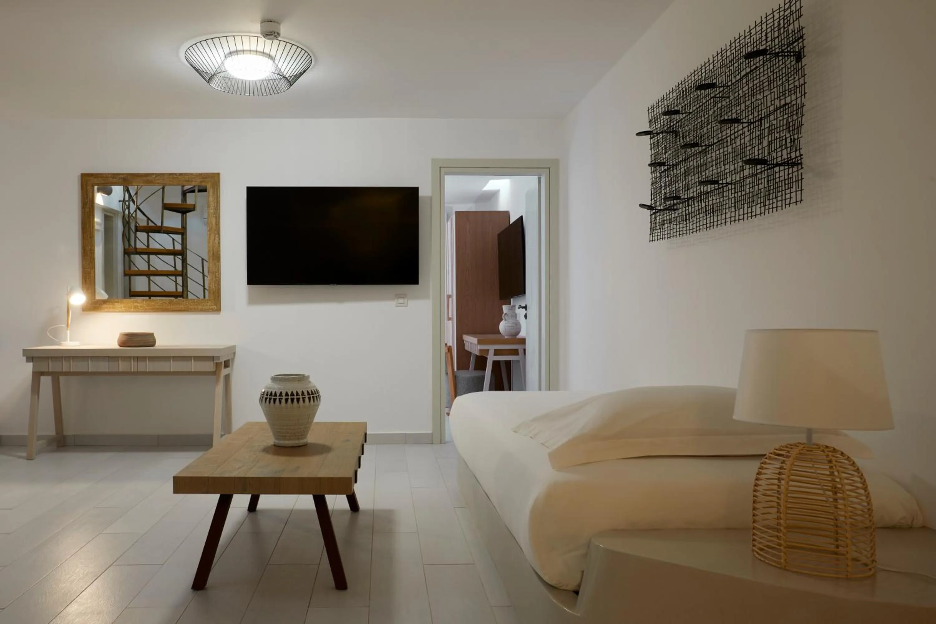 Bed in Sea Breeze Santorini Beach Resort, Curio By Hilton