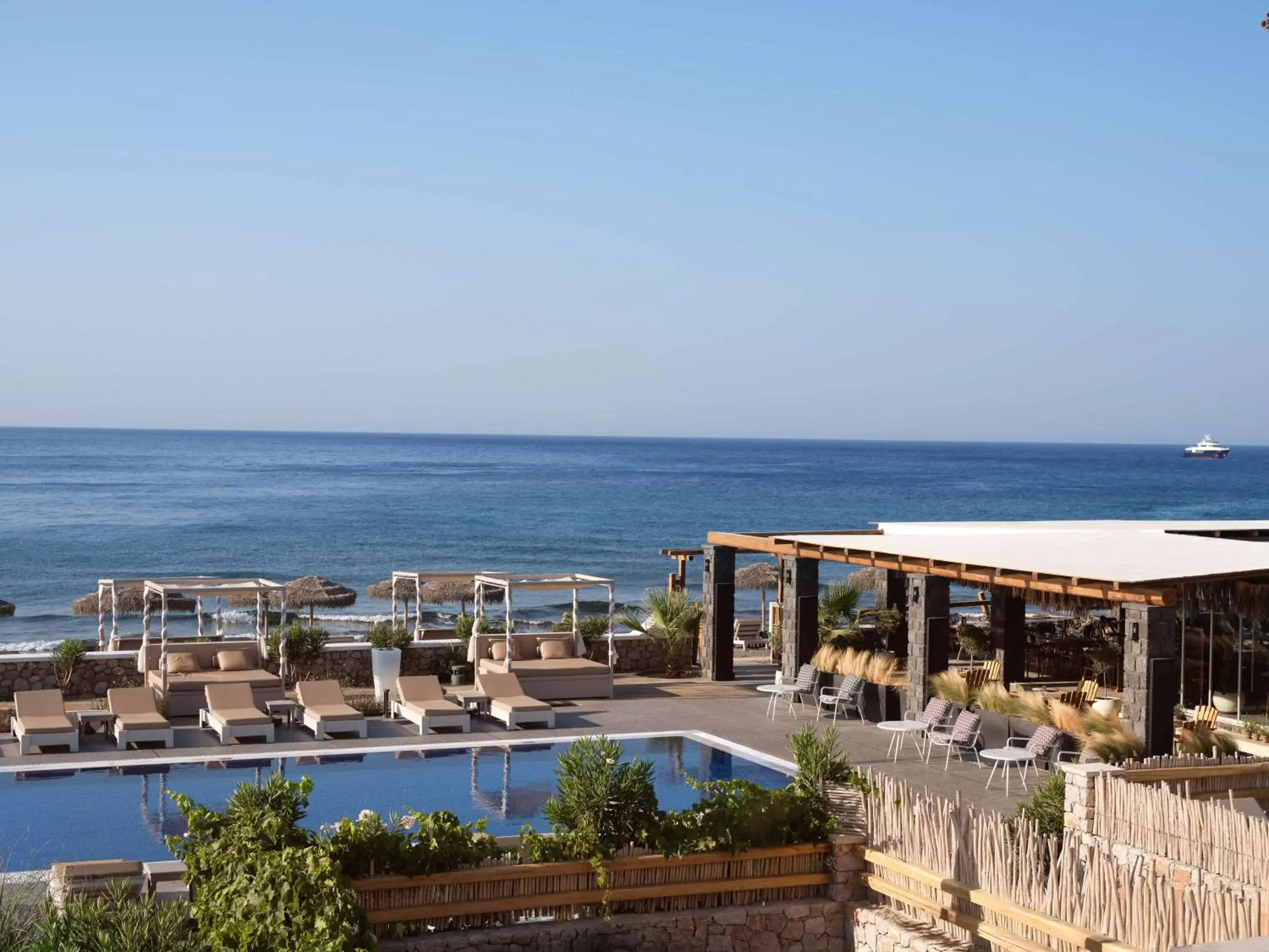 Pool view in Sea Breeze Santorini Beach Resort, Curio By Hilton Pool view in Sea Breeze Santorini Beach Resort, Curio By Hilton