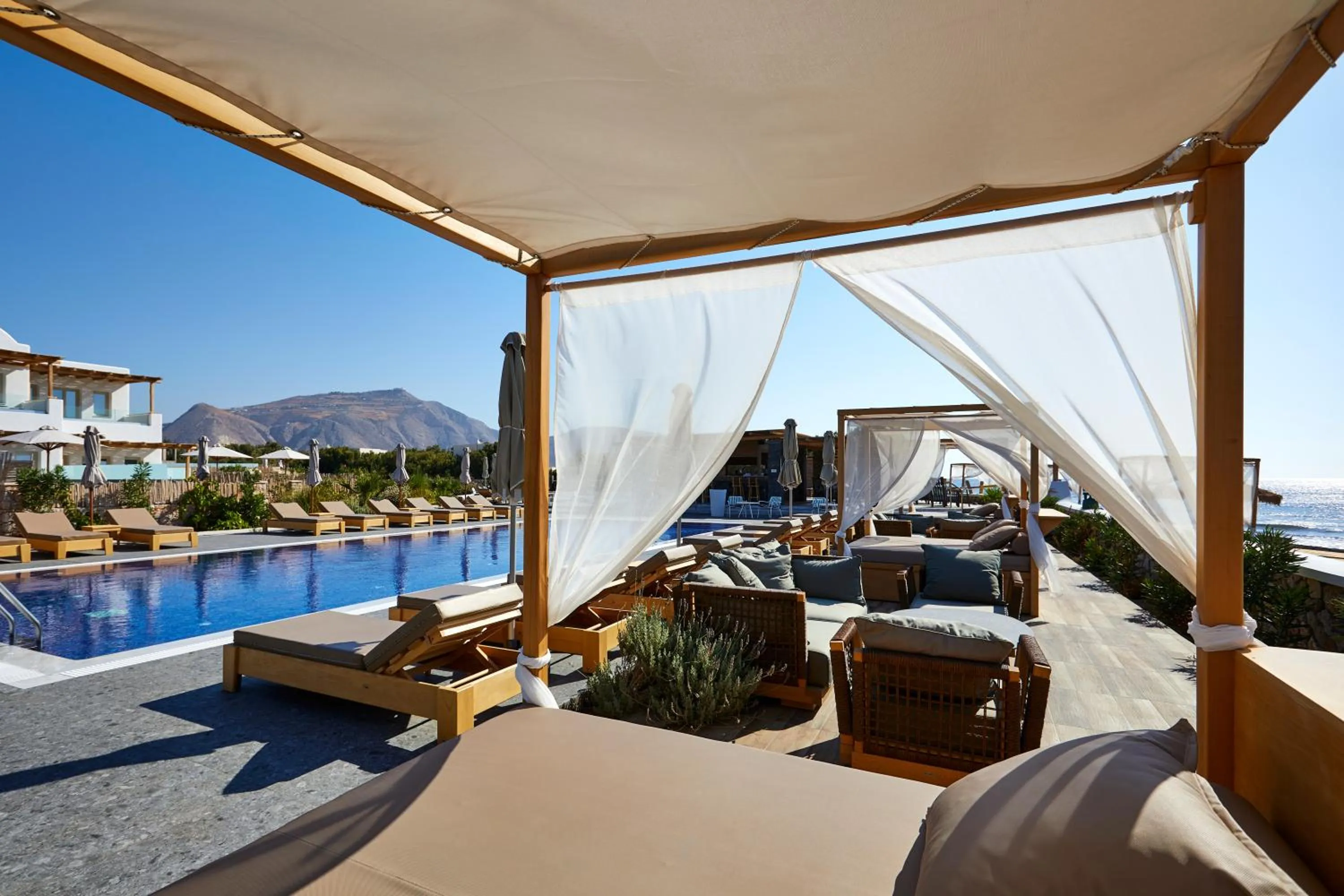 Beach in Sea Breeze Santorini Beach Resort, Curio By Hilton