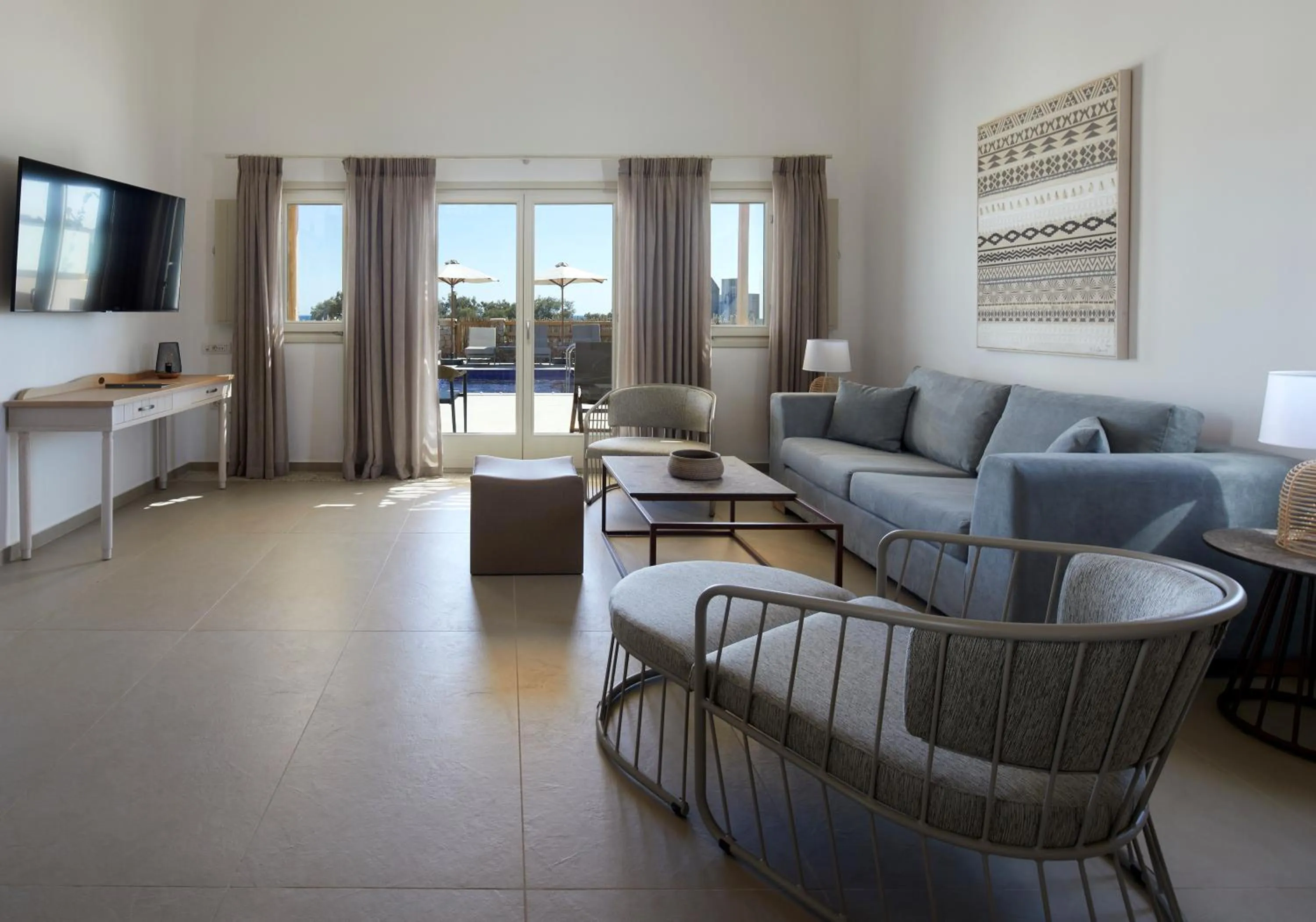 TV and multimedia in Sea Breeze Santorini Beach Resort, Curio By Hilton