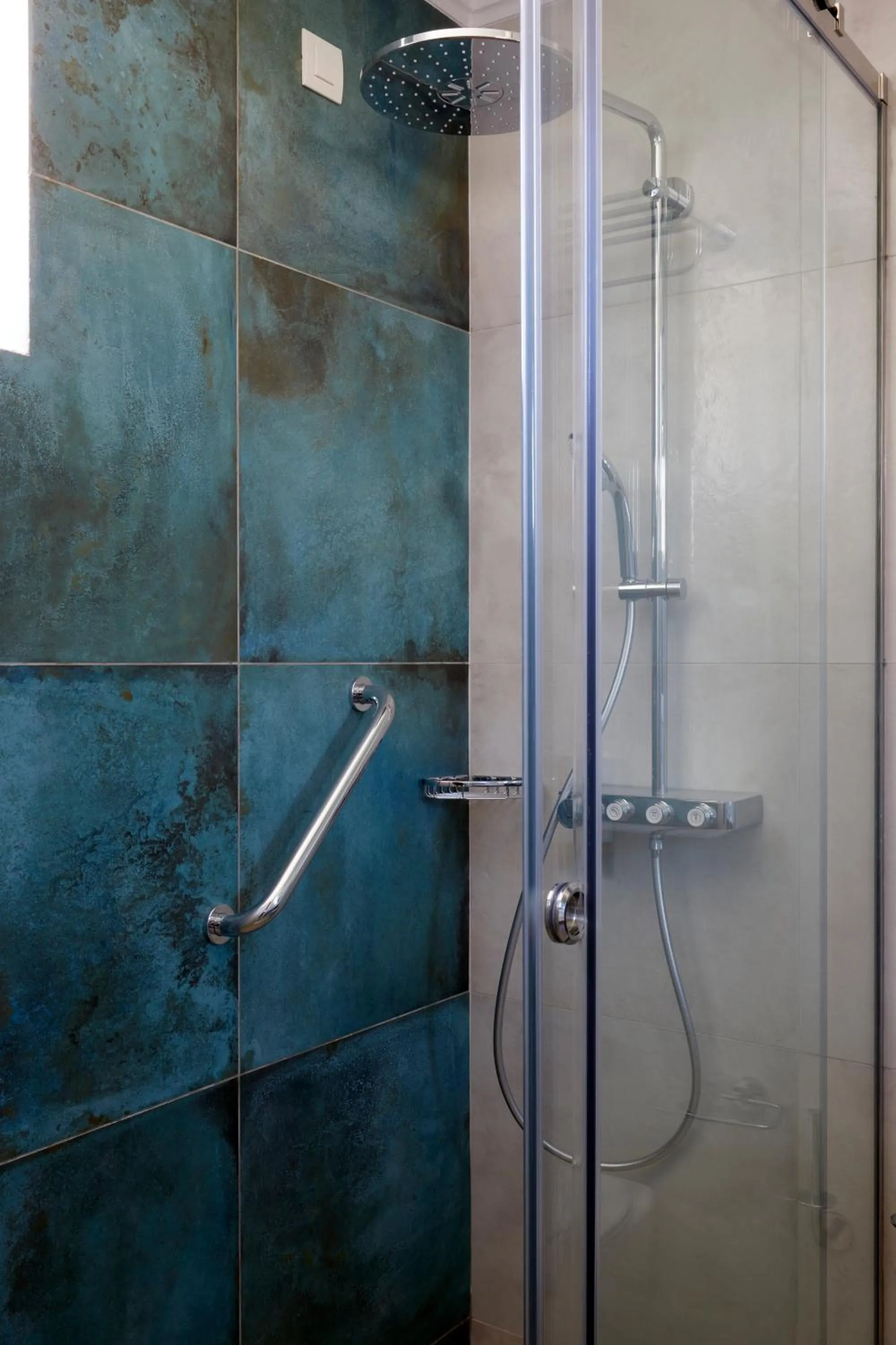 Shower in Sea Breeze Santorini Beach Resort, Curio By Hilton
