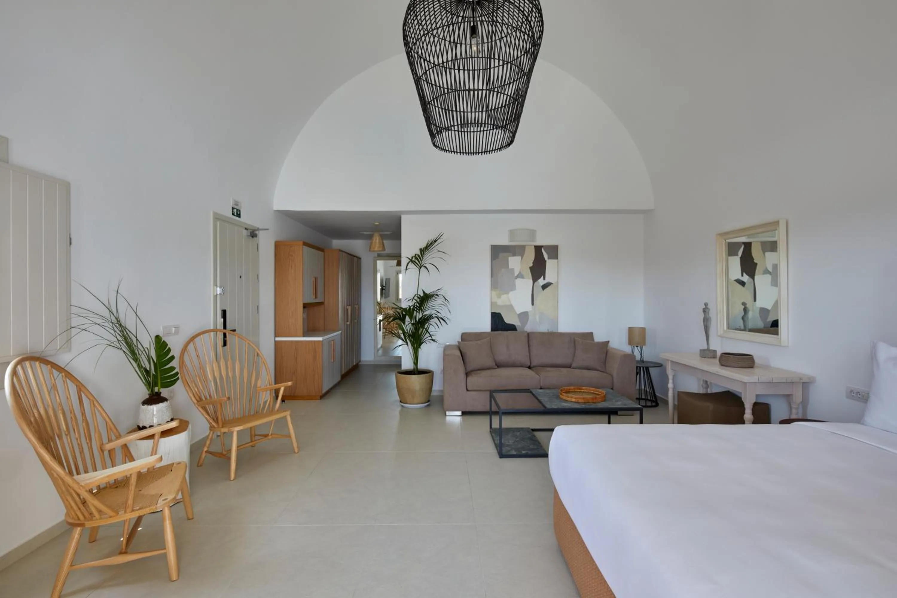 Bed in Sea Breeze Santorini Beach Resort, Curio By Hilton