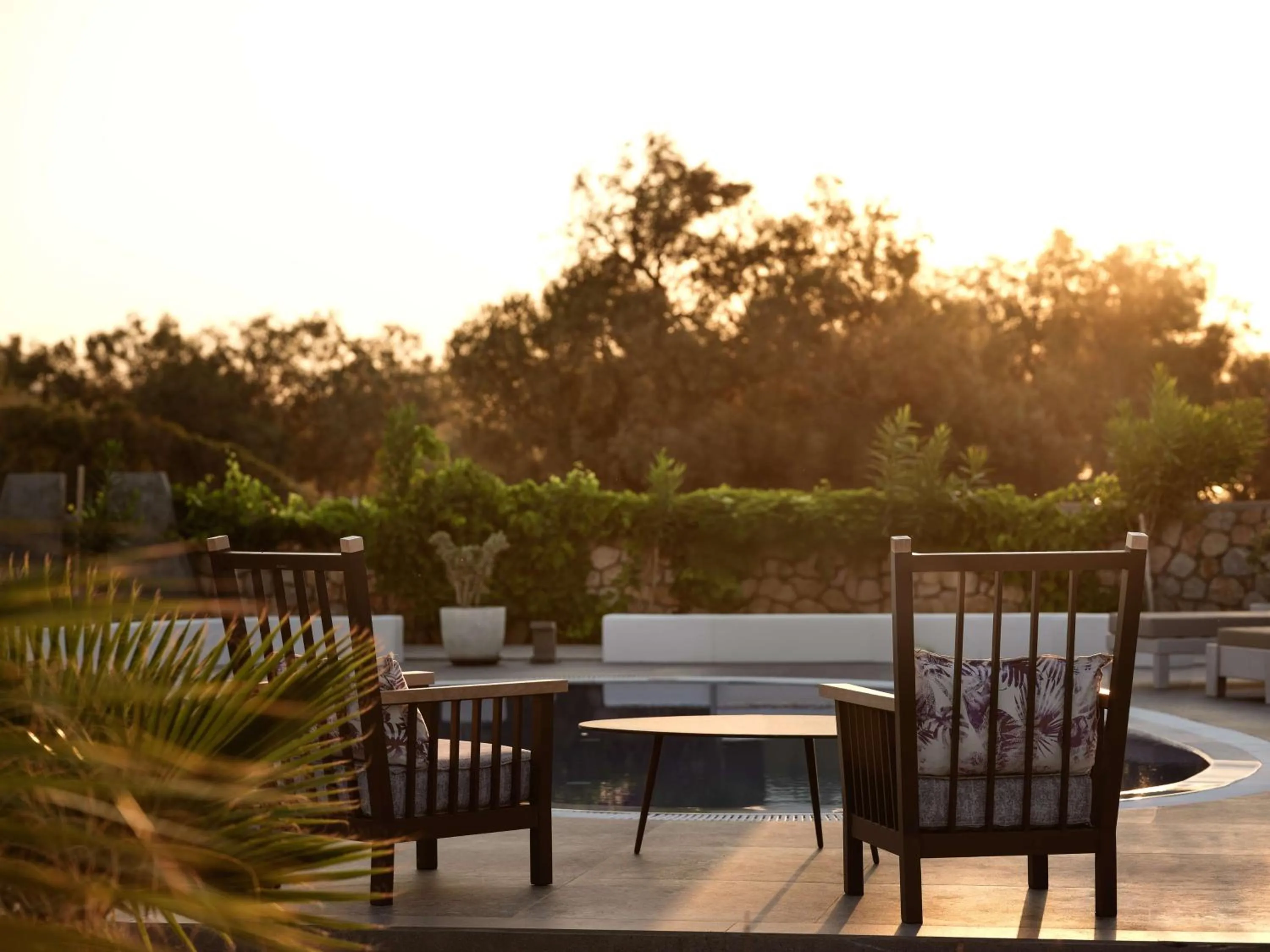 Pool view in Sea Breeze Santorini Beach Resort, Curio By Hilton