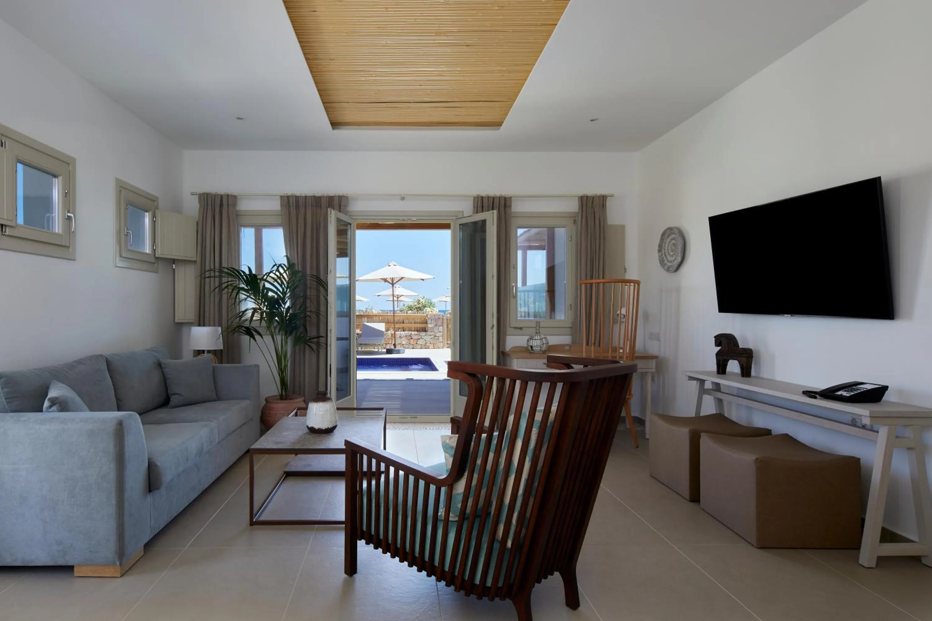 TV and multimedia in Sea Breeze Santorini Beach Resort, Curio By Hilton