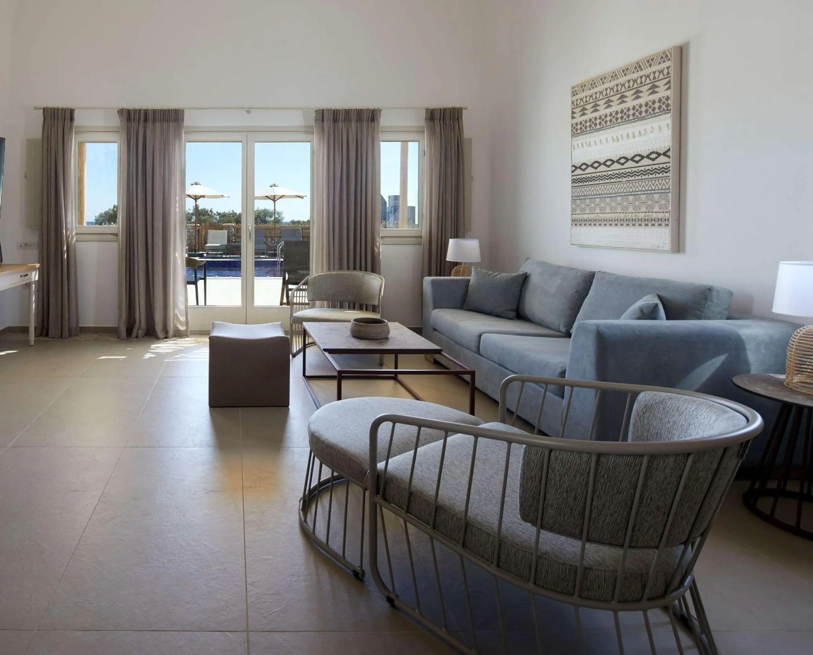 Living room in Sea Breeze Santorini Beach Resort, Curio By Hilton